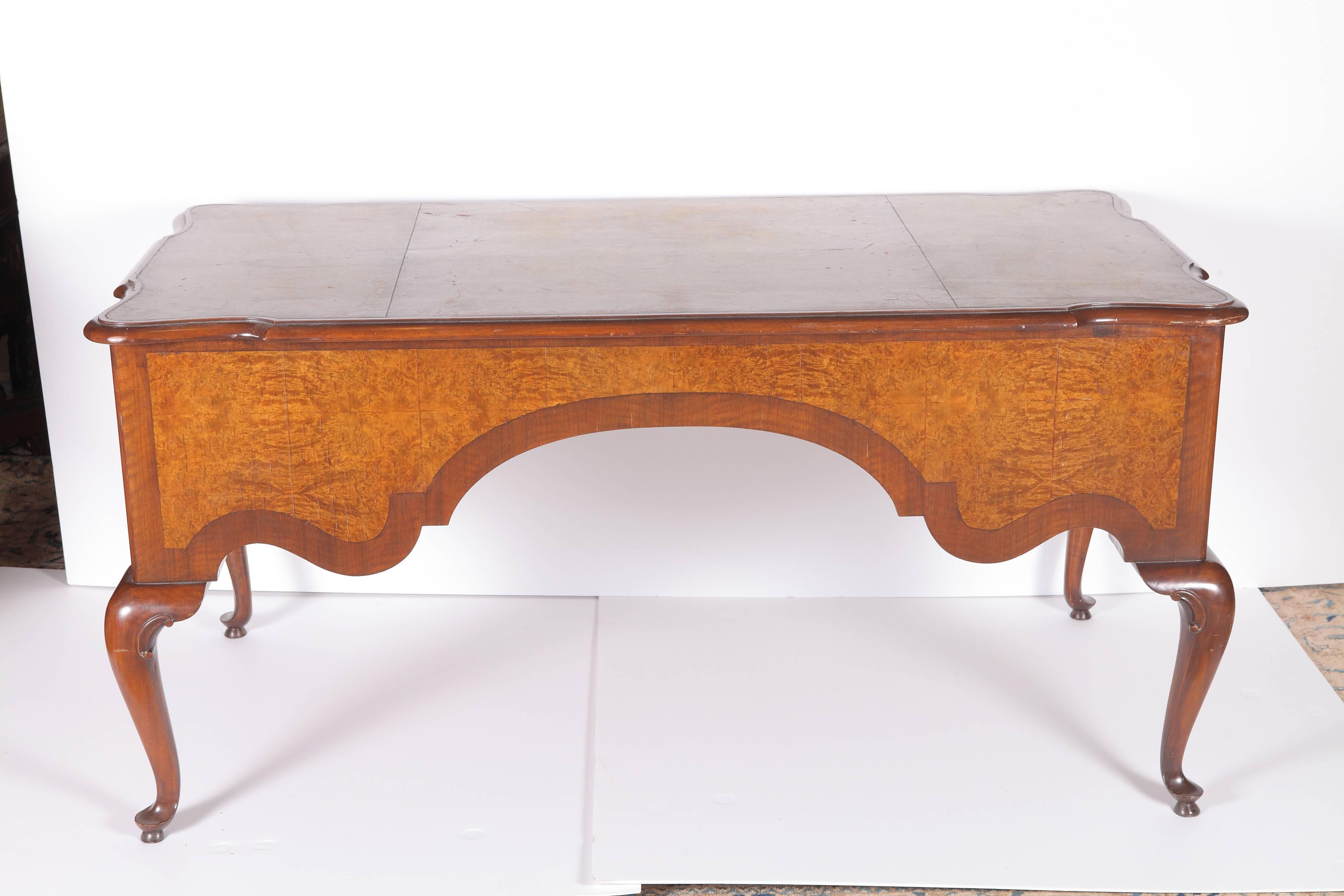 19th century walnut and burr walnut veneer Queen Anne style desk with leather top.
