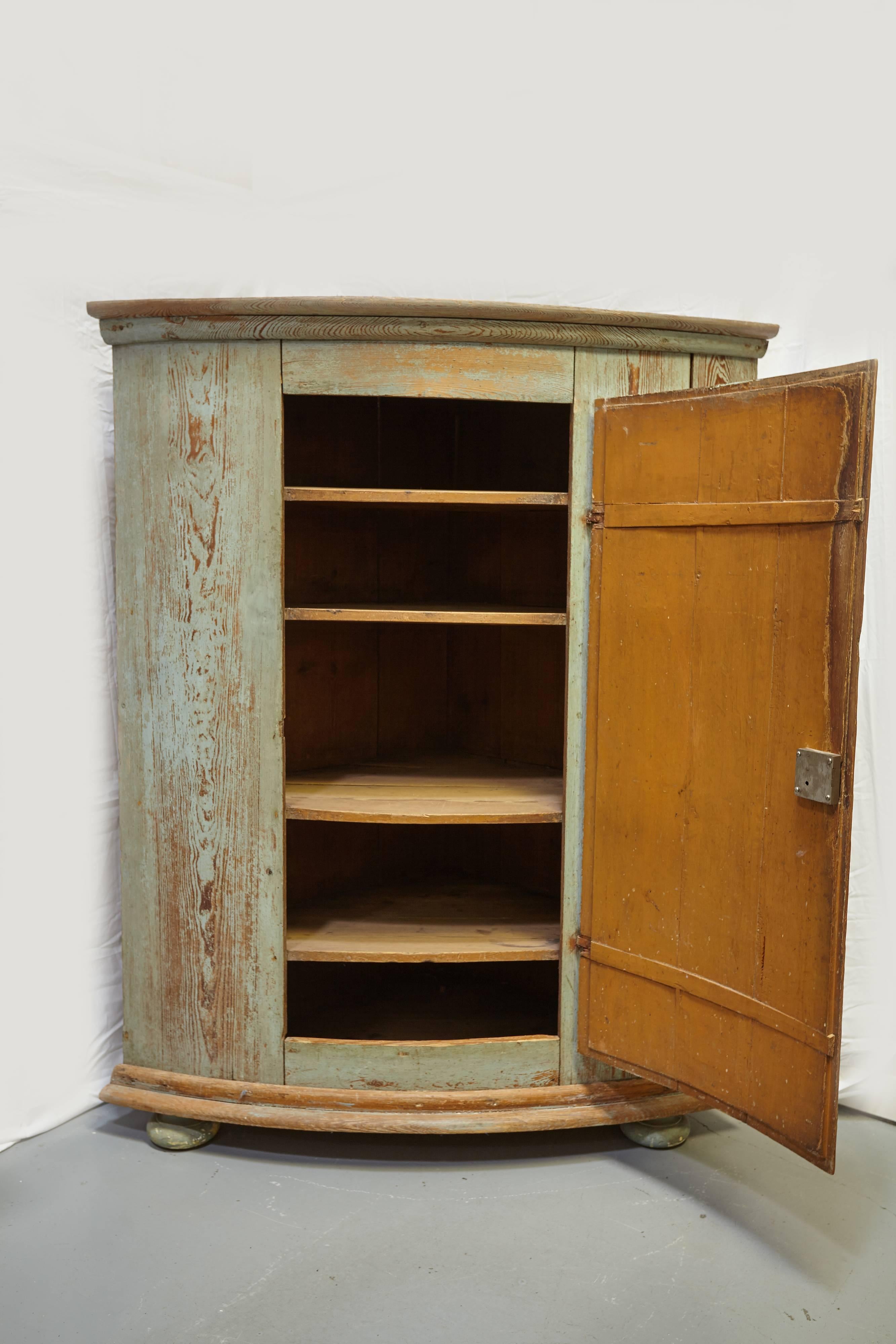 18th century, Gustavian corner cabinet crafted from pine wood with original blue paint and beautiful patina.