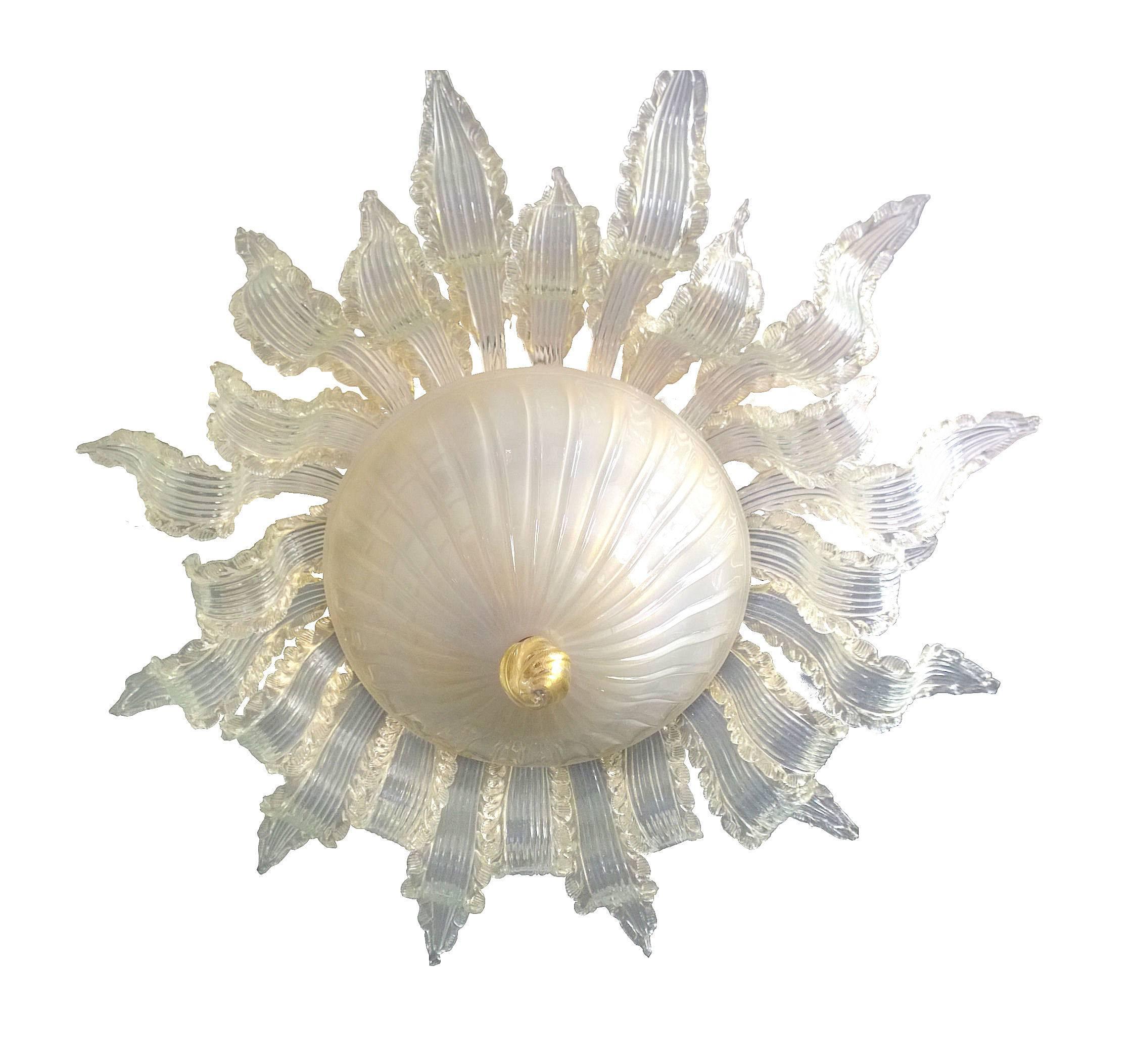 Murano chandelier by Ercole Barovier, circa 1940.  Inverted dome of translucent white glass surrounded by hand fashioned leaves of clear Murano glass radiating from the center dome.  The finial at the bottom of the fixture is gold flecked Murano