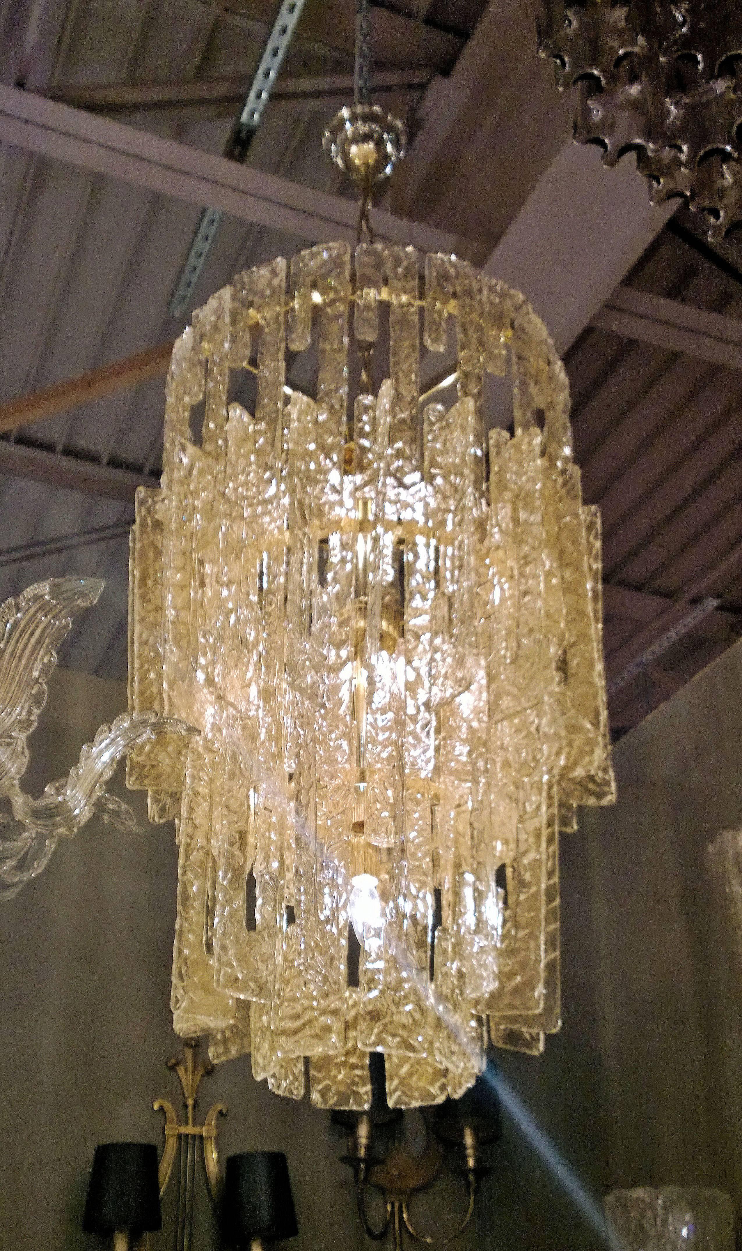 Mid-Century Murano chandelier attributed to Mazzega. Murano glass with heavy gold leaf inclusions.