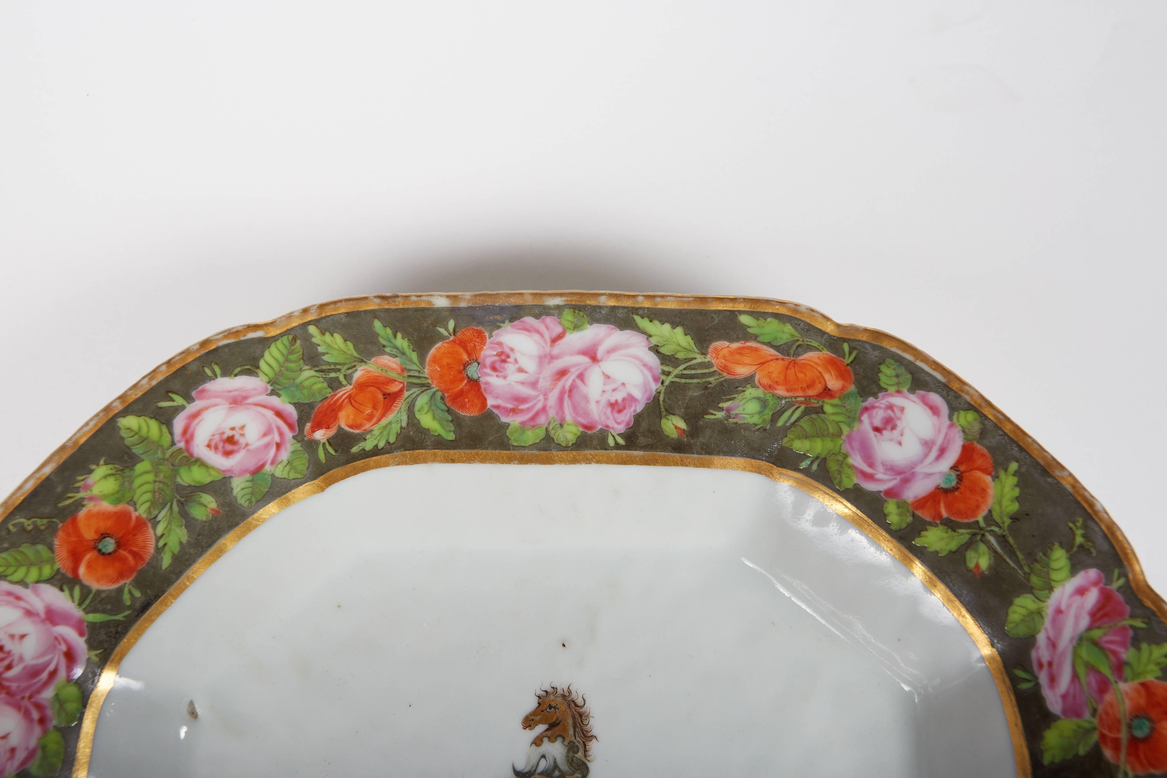Rare armorial tray bearing the arms of Smyth impaling Denison as described in Chinese Armorial Porcelain Vol. II by David Sanctuary Howard (p.669), Jiaqing, circa 1810. Beautiful European floral style border against a dark gray background with gilt