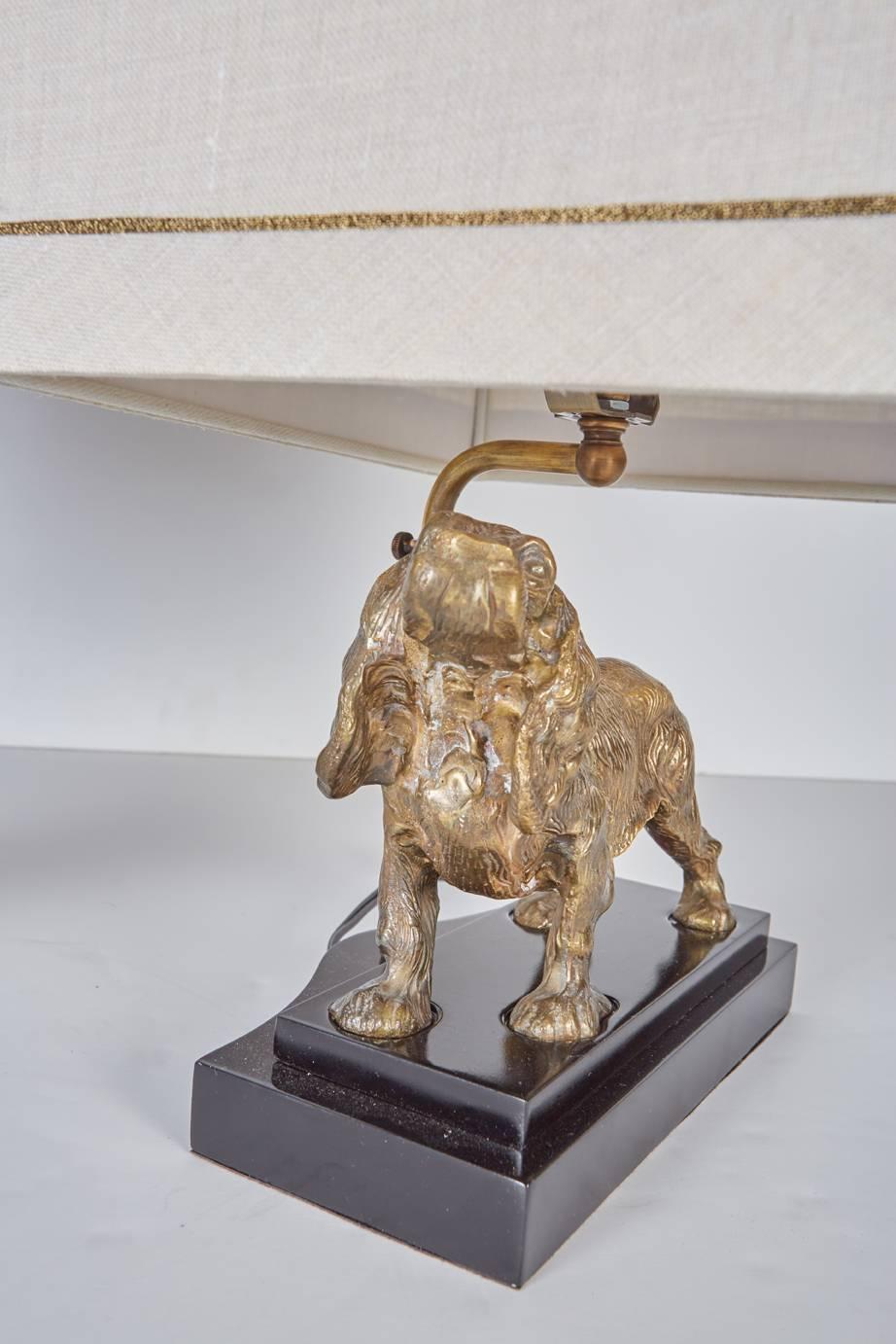 Linen Complementary Pair of Brass Dogs Mounted as Lamps