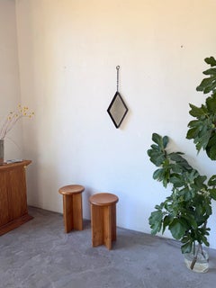 Brutalist diamond-shaped iron mirror