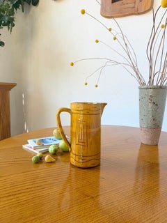 Jarra vintage de gres esmaltada en amarillo