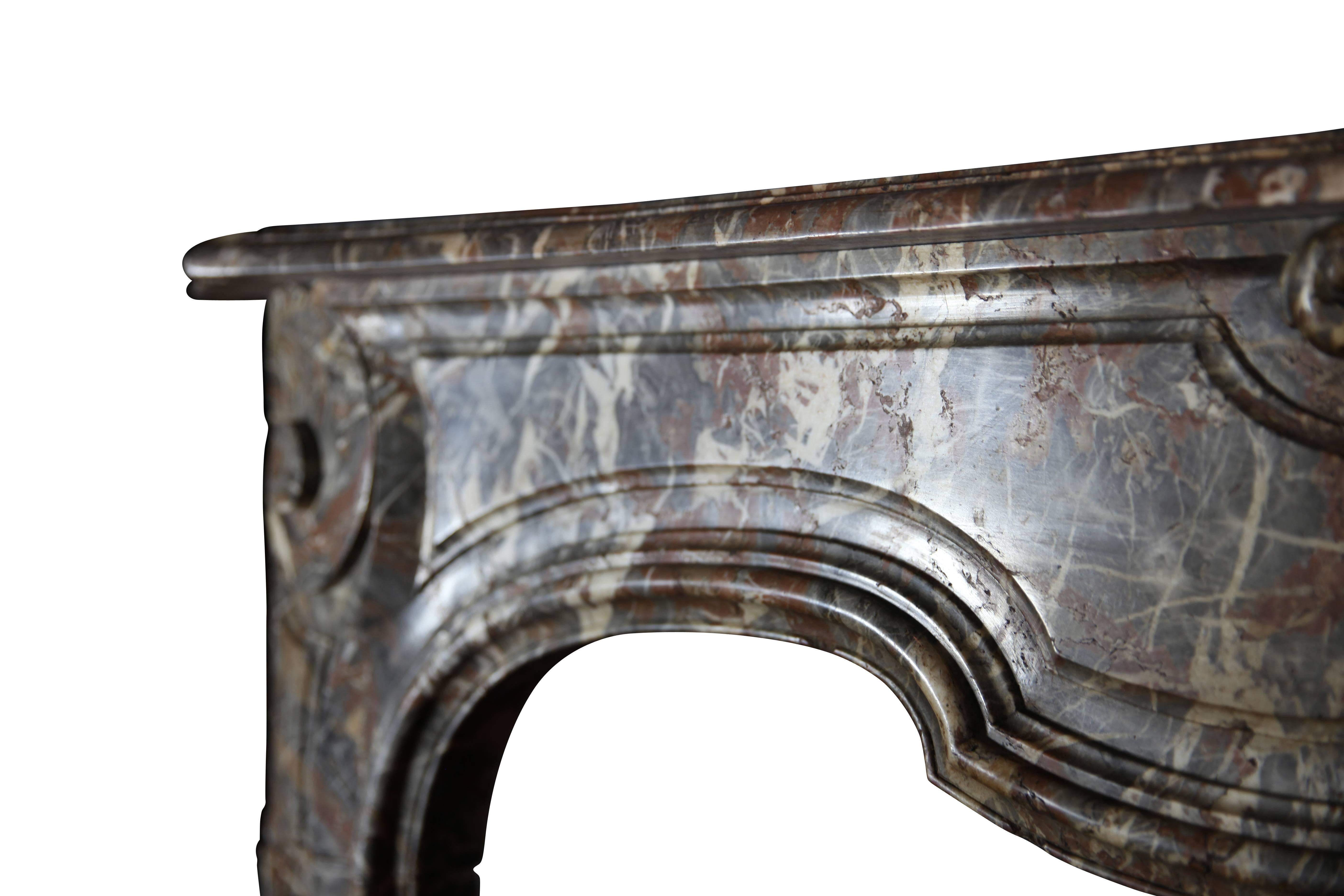 Monumental and exceptional original antique Belgian fireplace surround from Luik made out of the Belgian Gris d'ardenne marble.
A very nice and exceptional carving from the 18th century transition to the Rococo period. 
200 cm EW 78.74".
128