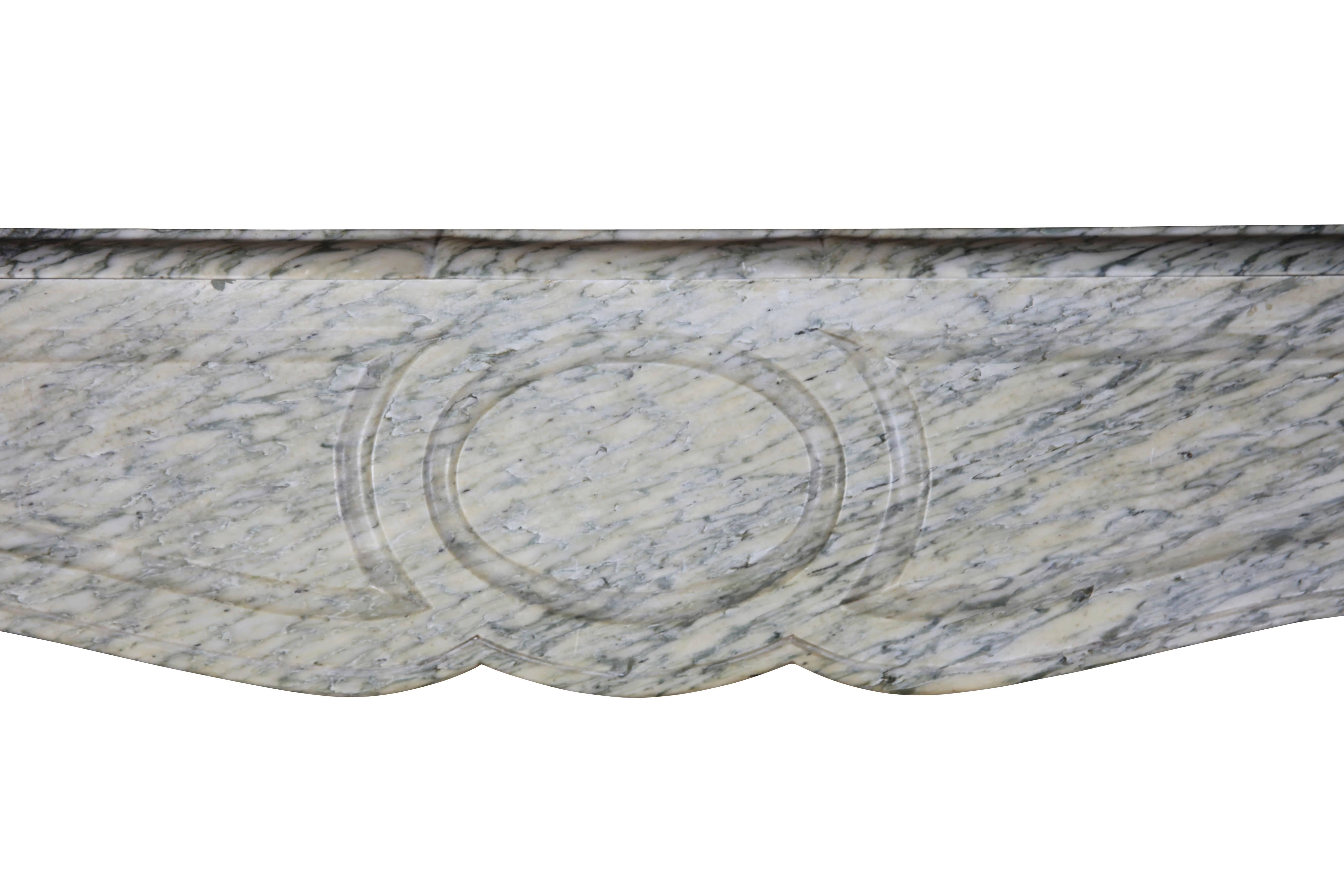 This petite original fireplace surround in Campan Vert marble from the south of France is perfect for a small room.

Measures:
112 cm EW 44.1”,
104 cm EH 40.95”,
78 cm IW 30.7”,
87 cm IH 34.25”,
34 cm S 13.38”.
 