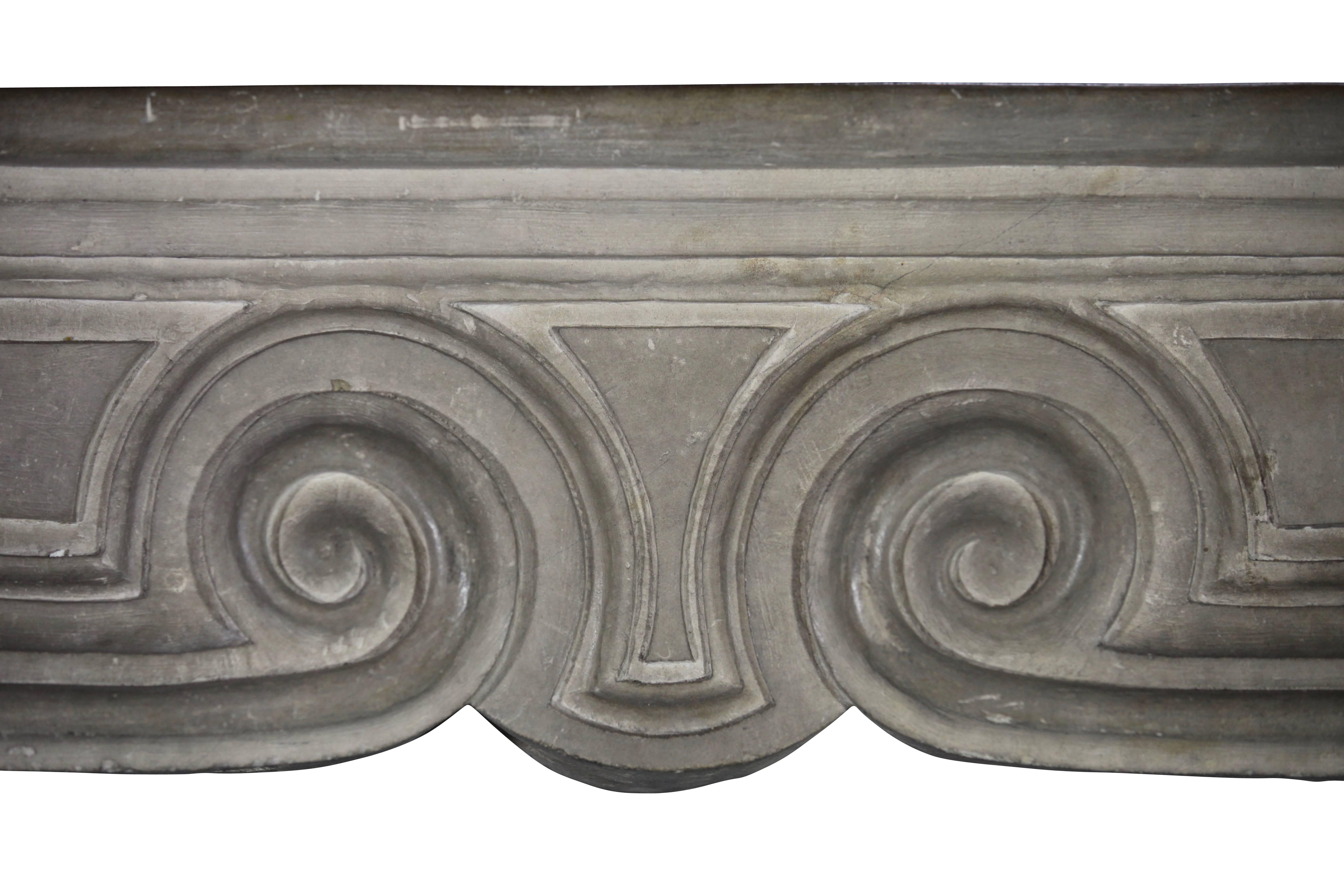This is a phenomenal Italian country original antique fireplace surround in limestone.
Original the front was prepared for a front of a Renaissance mantel. The remains of it you can see at the back of the front.

Measurements:
175 cm EW