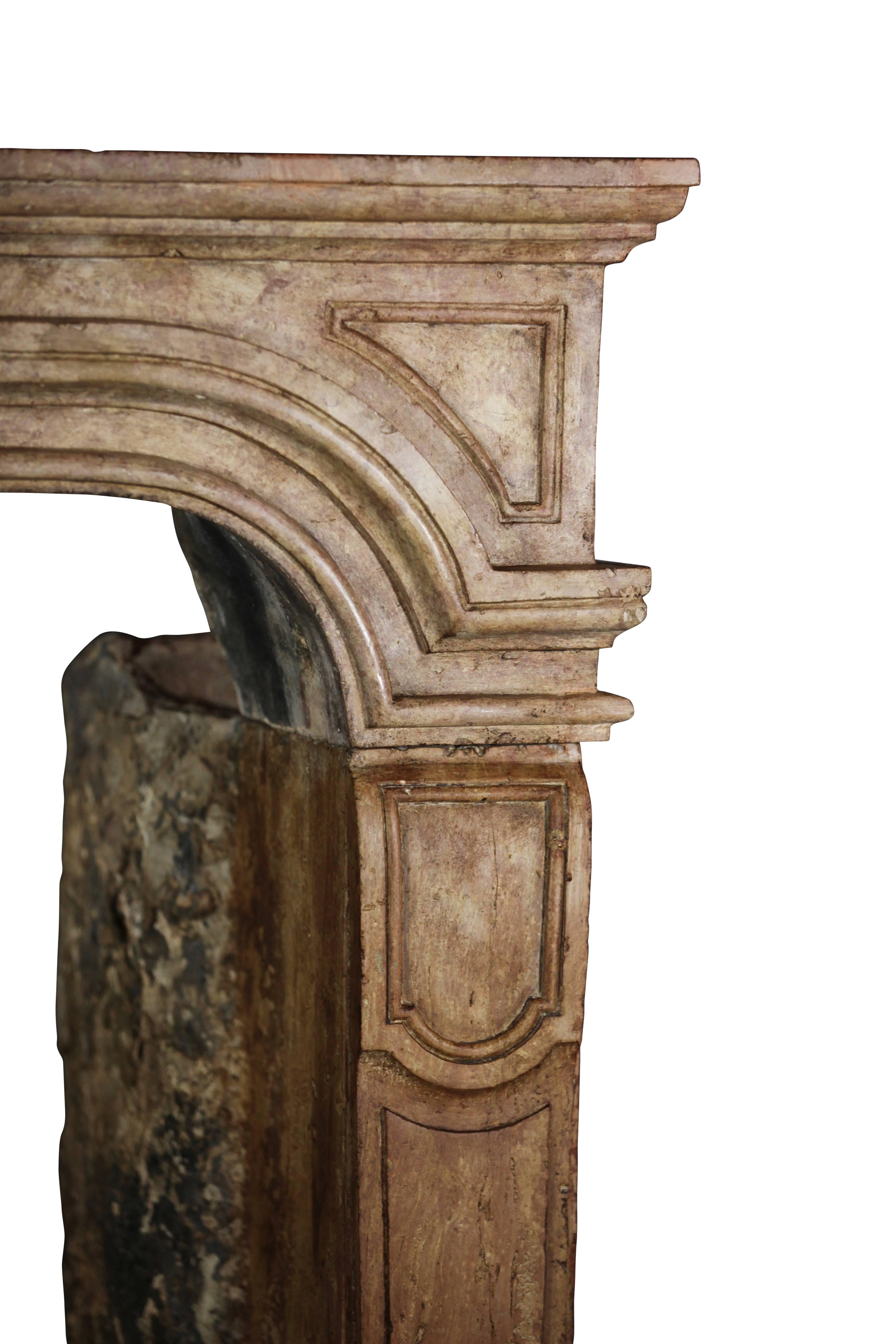 Hand-Carved 17th Century French Country Antique Fireplace Surround in Limestone For Sale