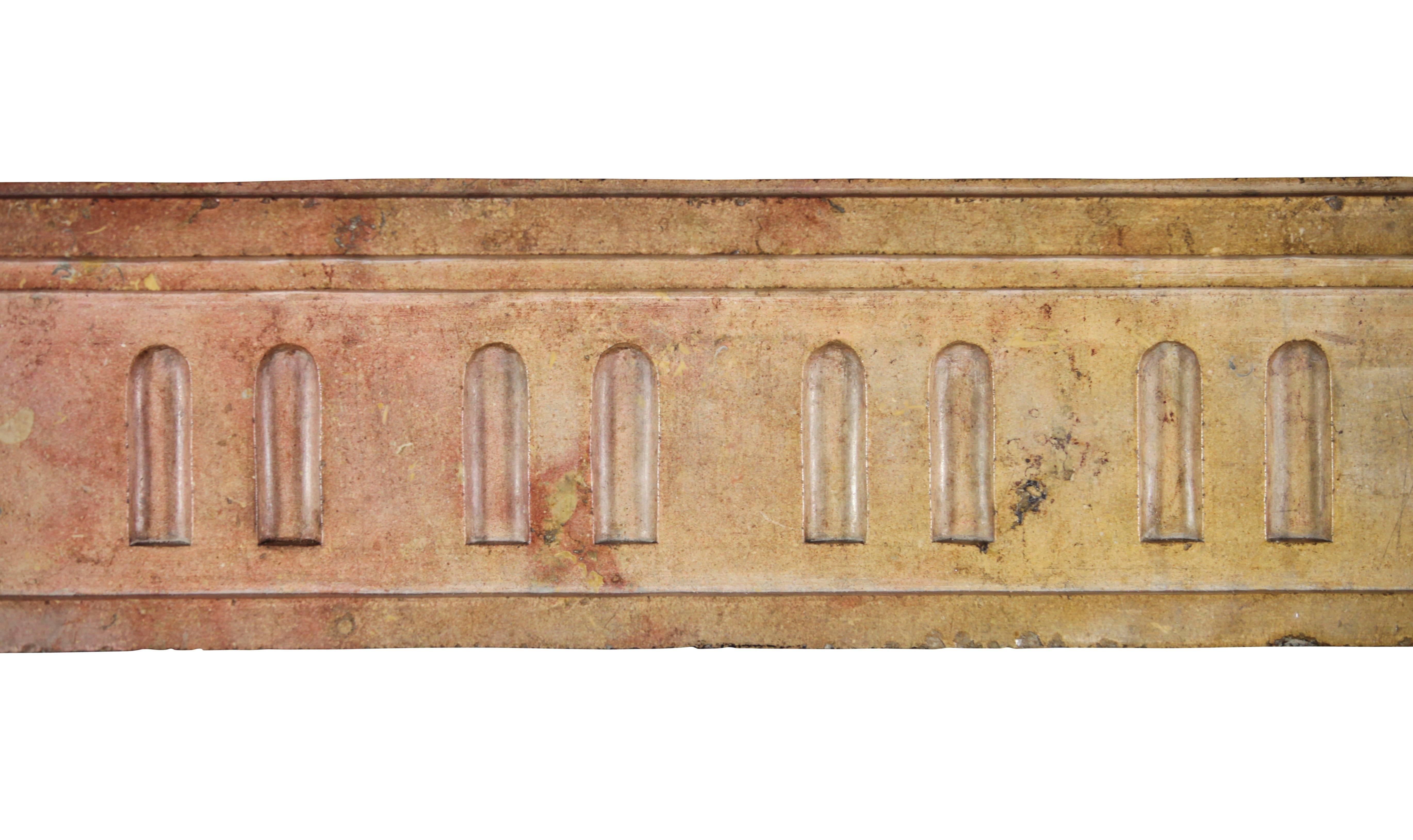 This is an original antique fireplace surround in Corton hard stone. The corton hard stone comes from a small town in the Burgundy area, Corton, in the mid of the vineyards. There is a difference in leg depth but original. This can be cut to the