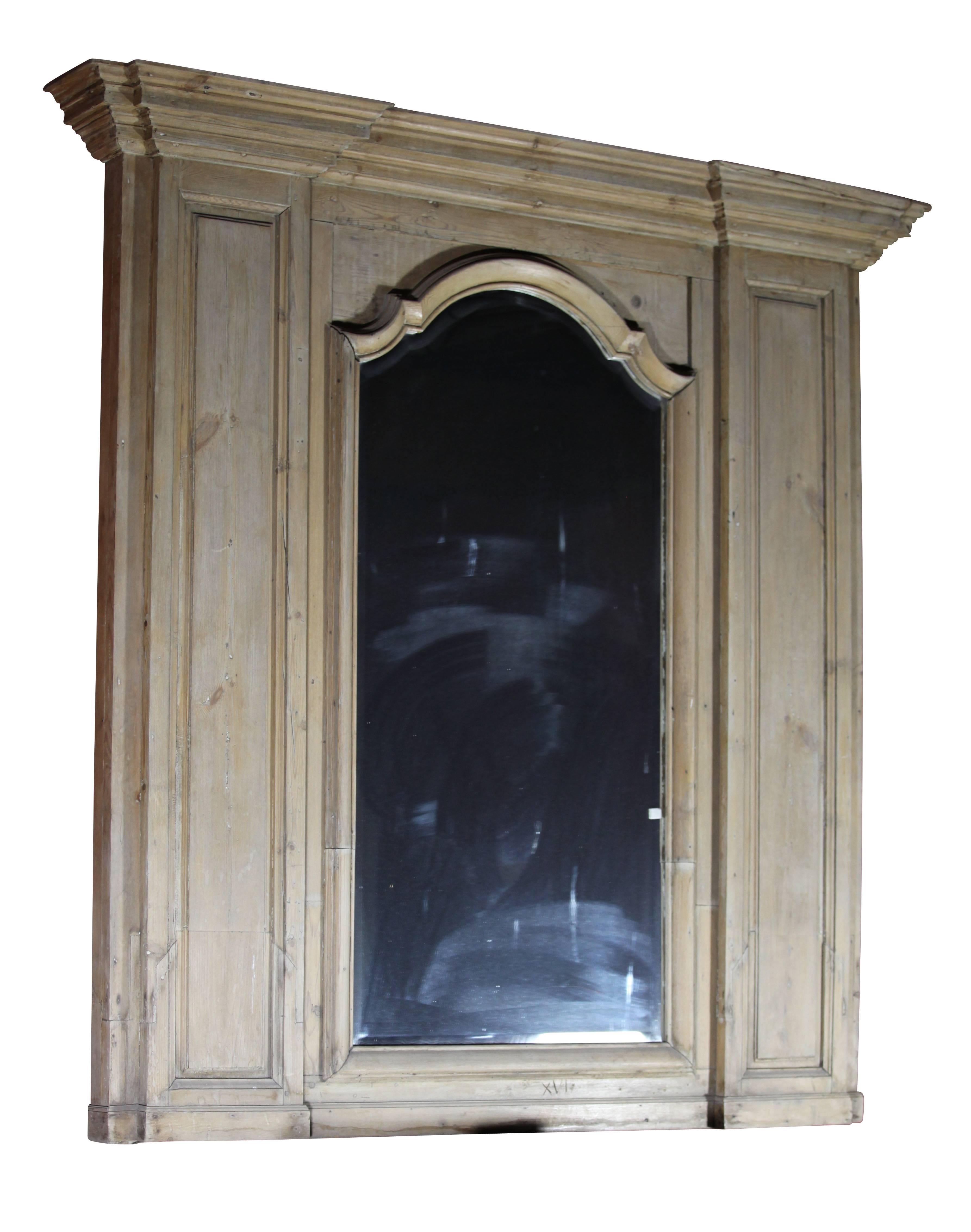 This original trumeau in pinewood comes out of a Louis XIV style paneled room and was installed above the fireplace surround.
The mirror is 20th century.
Measures:
167 cm EW 65,75".
192 cm EW+ 75,59"".
185 cm EH 72,83".
   