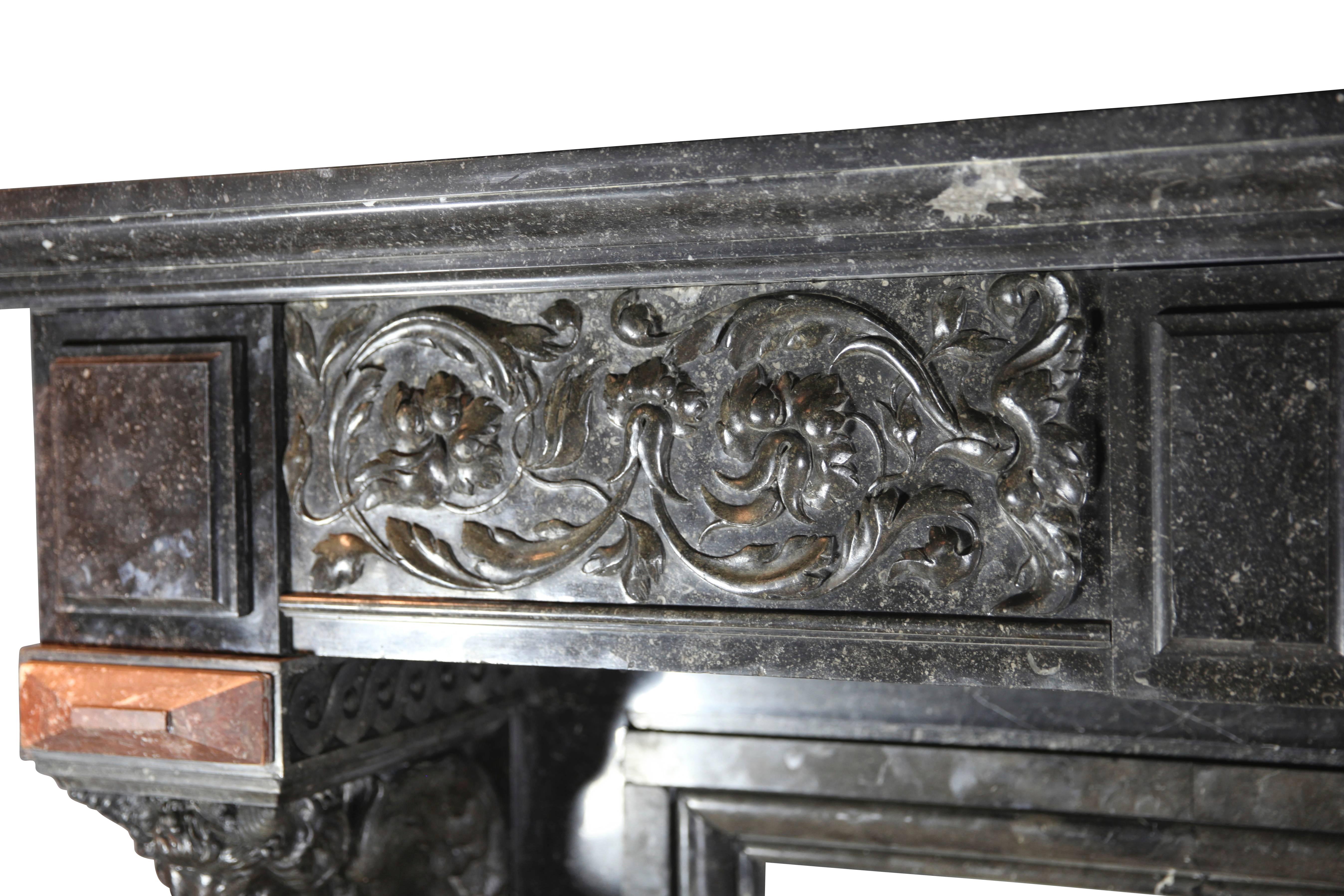 This fireplace surround has been built in Belgian Bleu granite with Rouge de Rochefort marble details. The caricatures are very unique with strong impressions. This is one of a kind piece.
Measures:
178 cm Exterior Width 70. Inch
165 cm Exterior