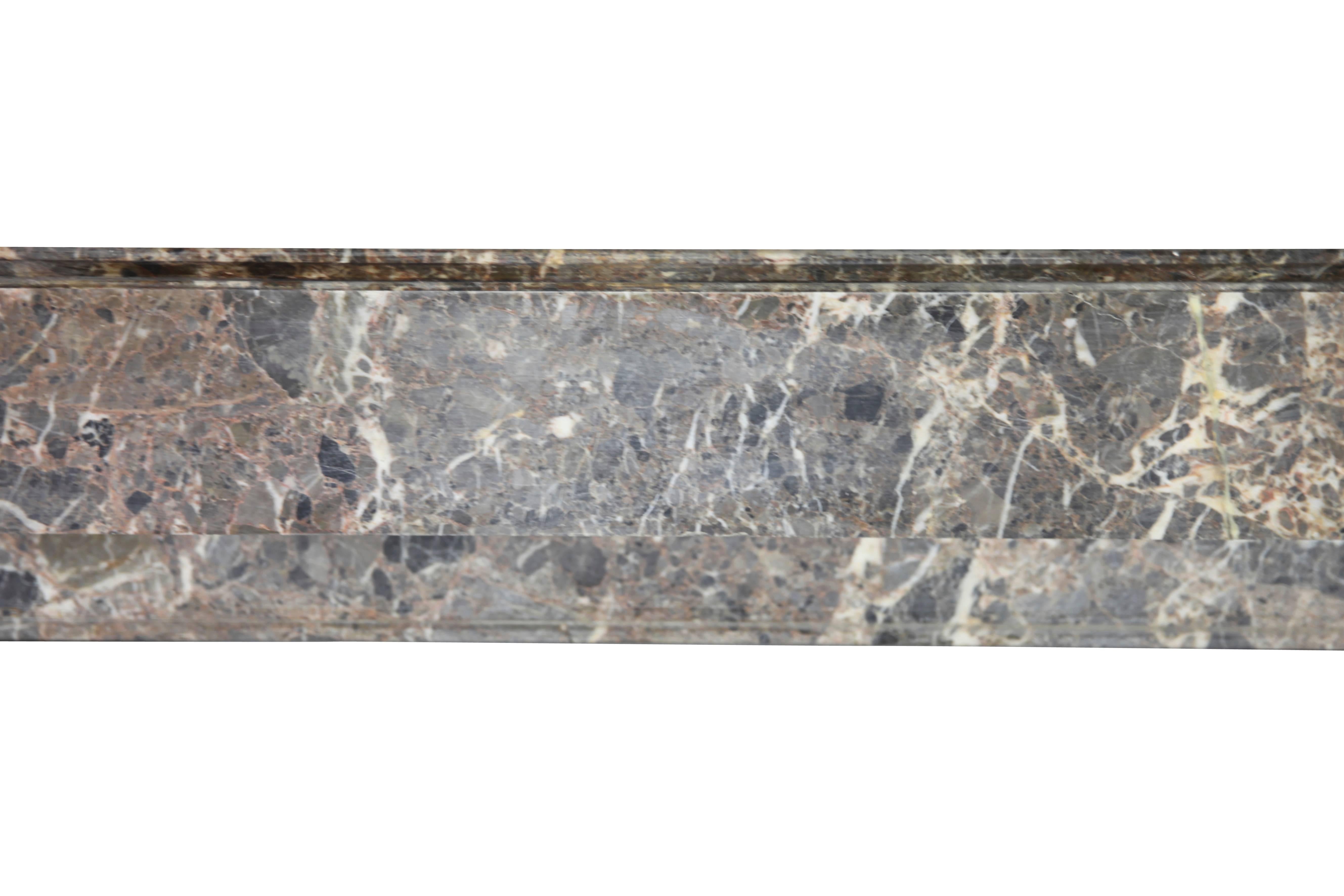 This is a fine petite original fireplace surround in a nice colored marble.
Measures:
130 cm EW 51.18",
102 cm EH 40.16”,
93 cm IW 36.61”,
83 cm IH 32.67”,
34 cm S 13.38”.
 