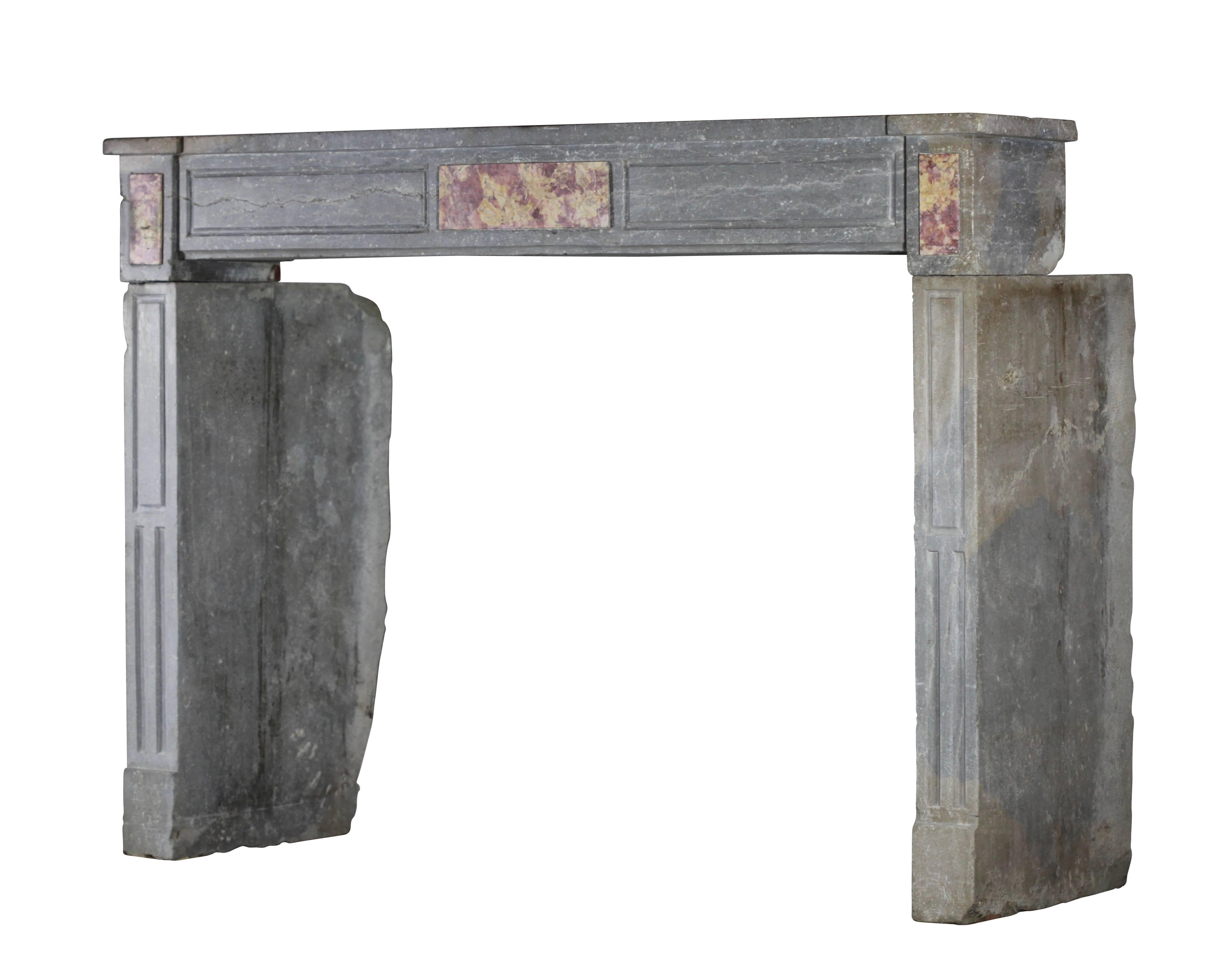 This antique fireplace surround in beaujolais bicolor hard stone, named Buxy with an Italian influence and Brocatelle de Spain marble inlay comes out of a paneled room. It has a little country touch.
Measures:
149.5 cm EW 58.85",
110 cm EH