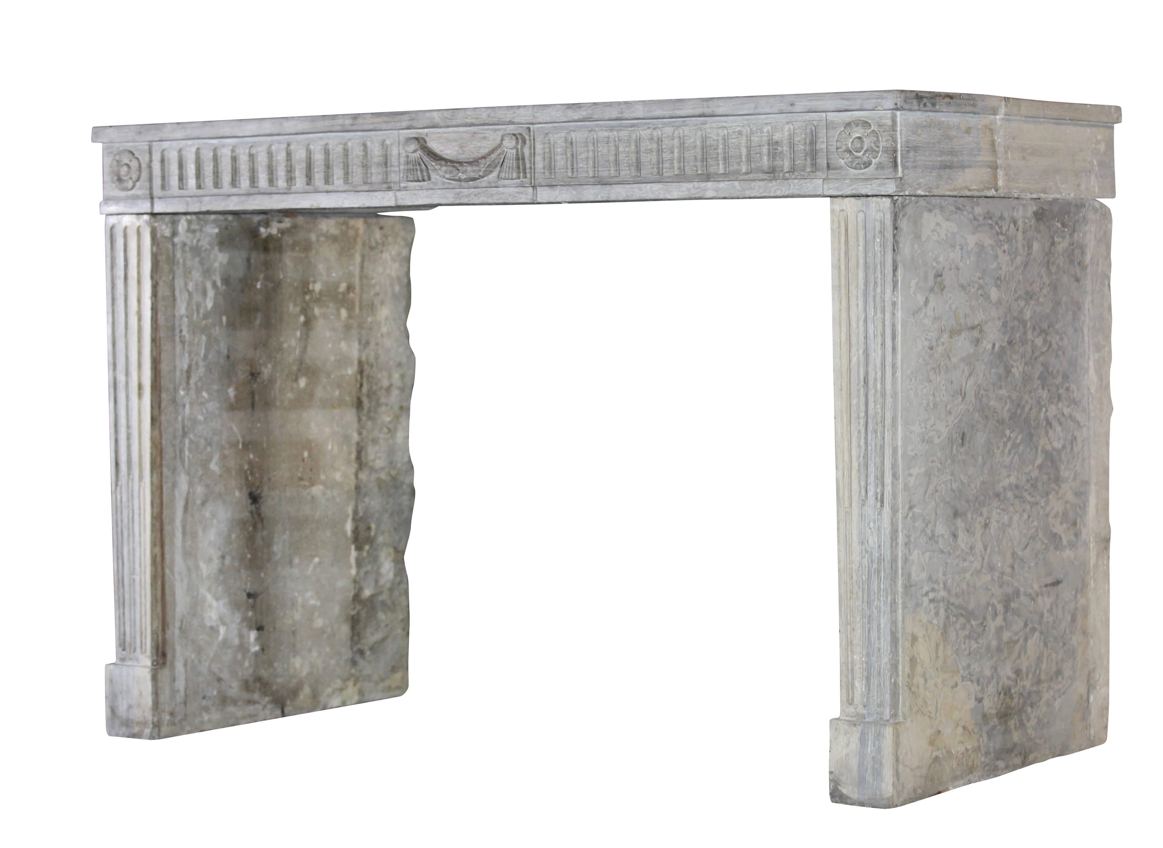 This is a very unusual limestone original antique fireplace surround. The bicolor stone is a great match for different interior design. This mantel has very deep legs and can be built around body.
The grey-beige is easy to match with modern,