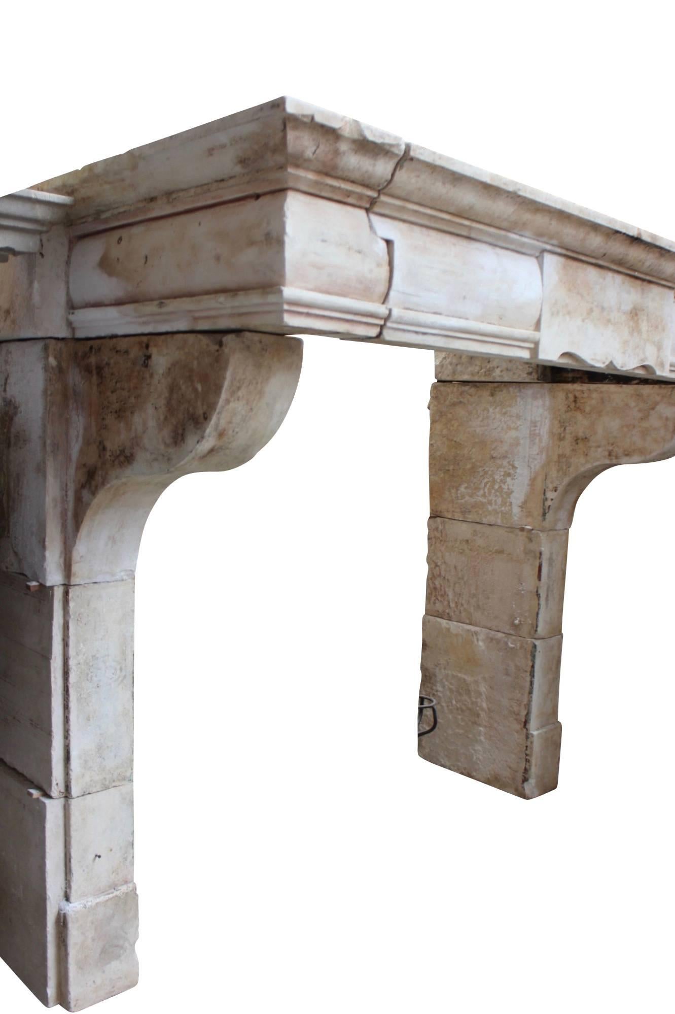 This rather clean and elegant limestone LXIII period fireplace surround has a center panel. The front is is round. Again this one is in a perfect condition and a fit for many interior design types. A fireplace mantel in which one can stand. Could be