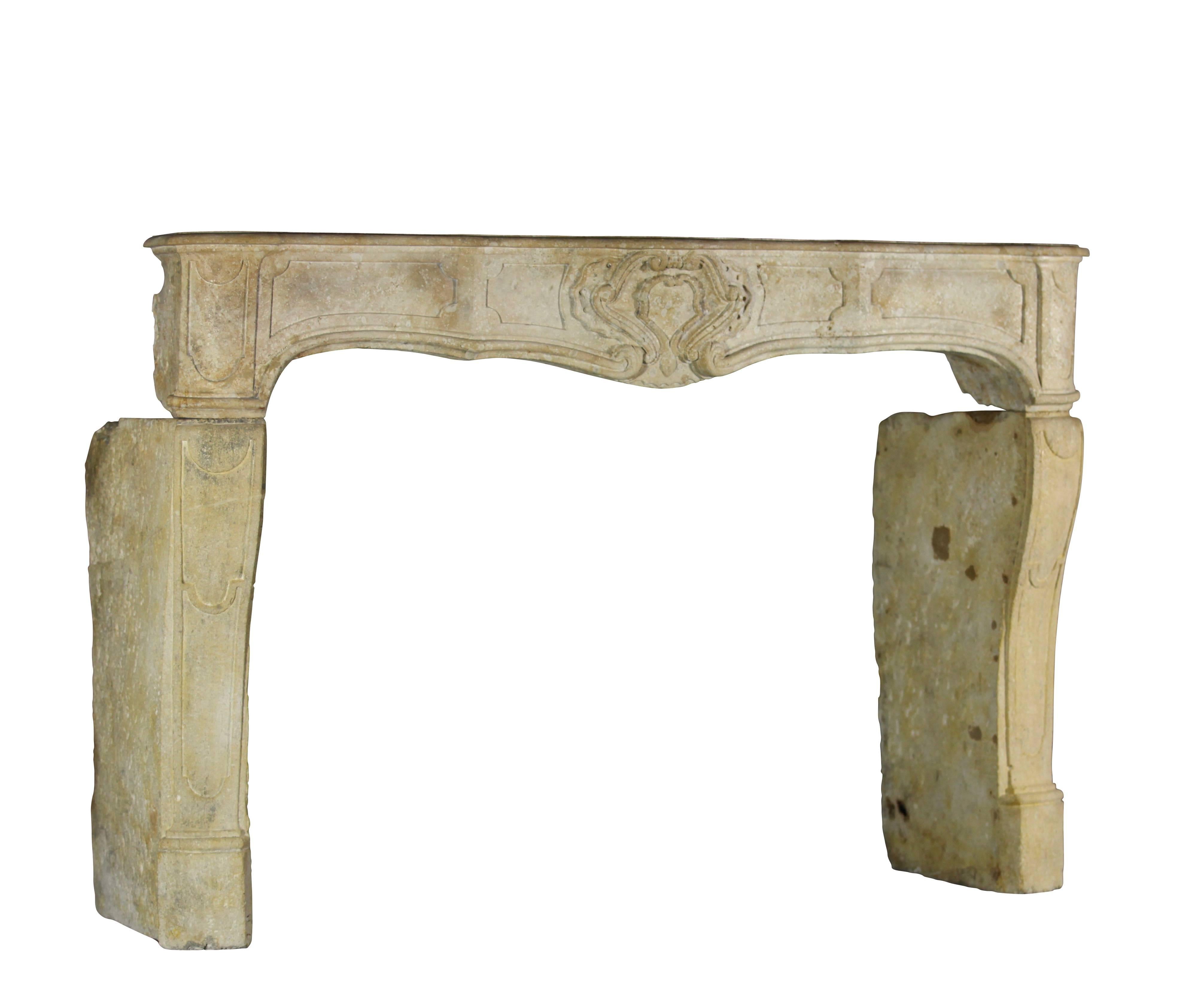 A very special and typical French country original antique fireplace mantel from the south of France. Very rich moving on the front. The center cartouche has a hart like design.

Measures:
171 cm EW 67.32