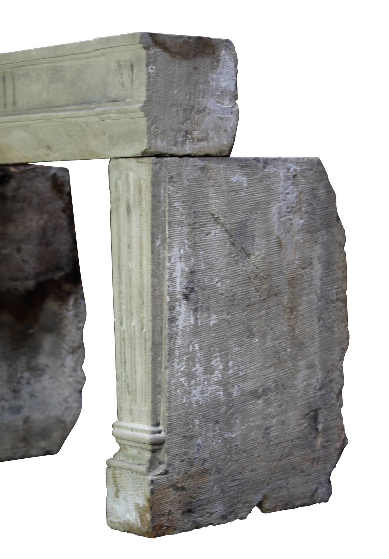 This 18th century Grez stone fireplace mantel (fireplace) with remains of the polychrome and original patina consists of 3 solid blocks. This mantel is from the Louis XVI period. It is perfect for a country style house or chalet in the mountains to