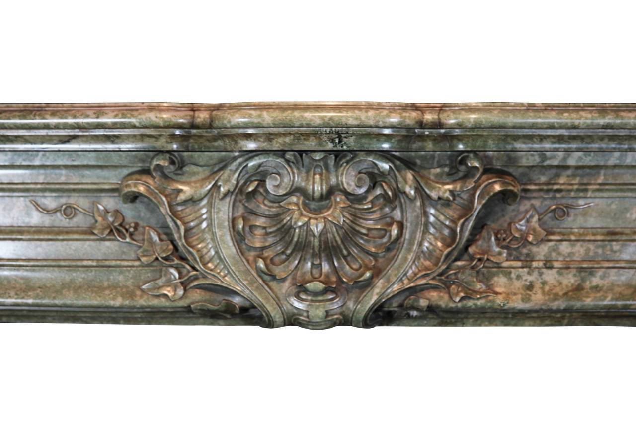 This is an amazing antique fireplace surround; it is an exceptional, original, museum quality mantel. It is of the Rococo Revival period from the third Republic. This exquisite green marble was used till the mid war period.
This marble was used in