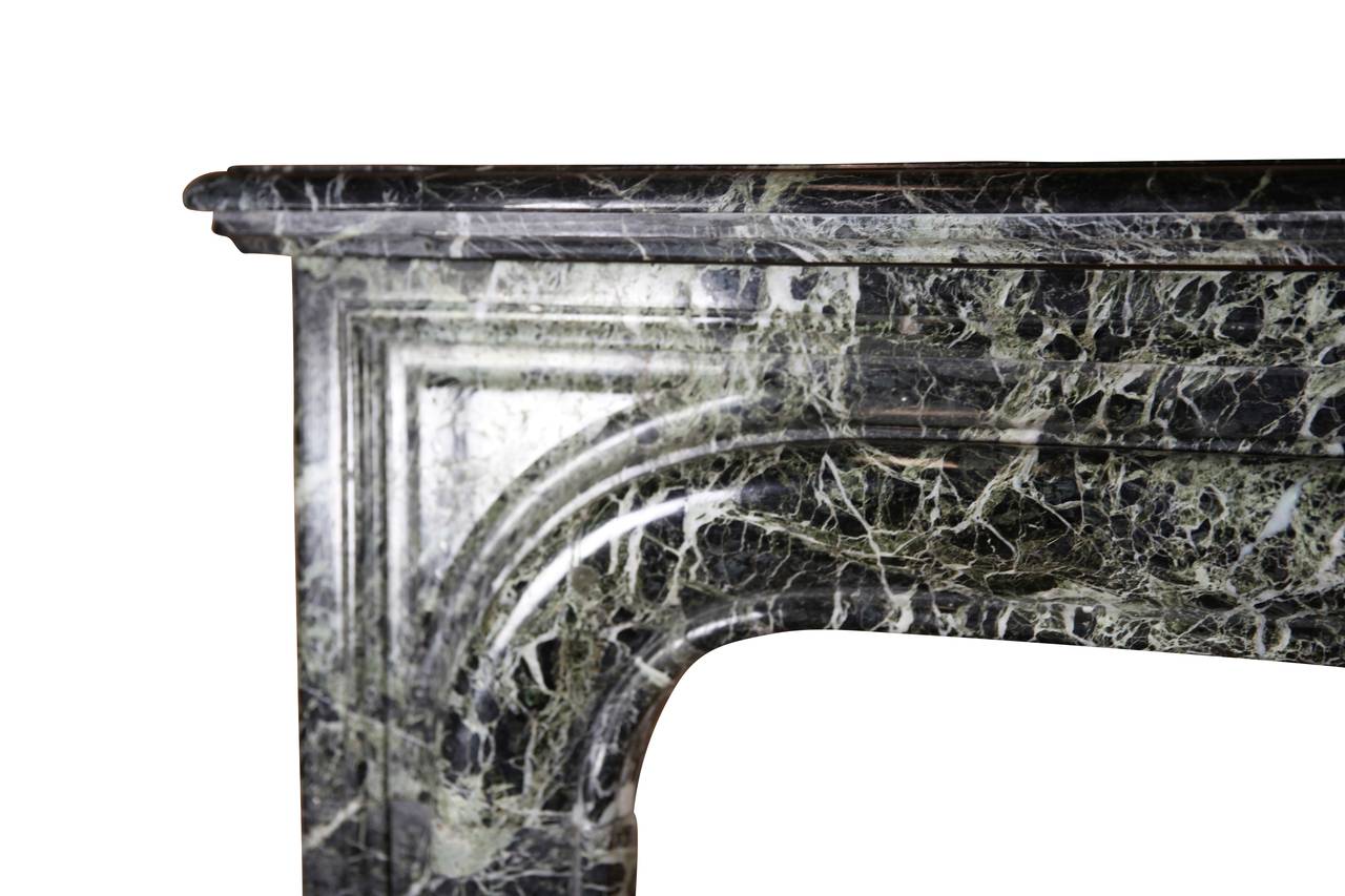 A great original vintage chimney piece to create a French style cosy look. The antique surround is in a perfect condition and ready to be installed. The Green marble, the Vert Maurin, was used in a lot of historical landmarks in the world. It is the