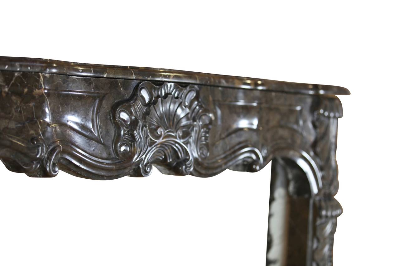 Polished Beautiful Belgian Antique Fireplace Mantel in Marble with Special Fronton For Sale
