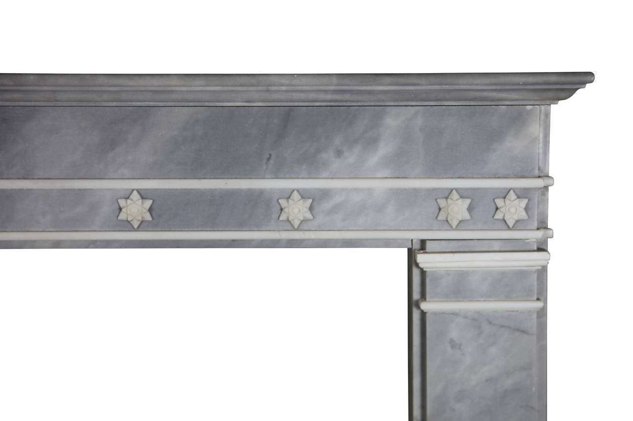 This exceptional Italian fireplace surround is in white statuary and grey-blue marble. This work of art was found in Venice, Italy. The mantel was crafted in the 19th century. It is a great piece for a high end bespoke interior decoration