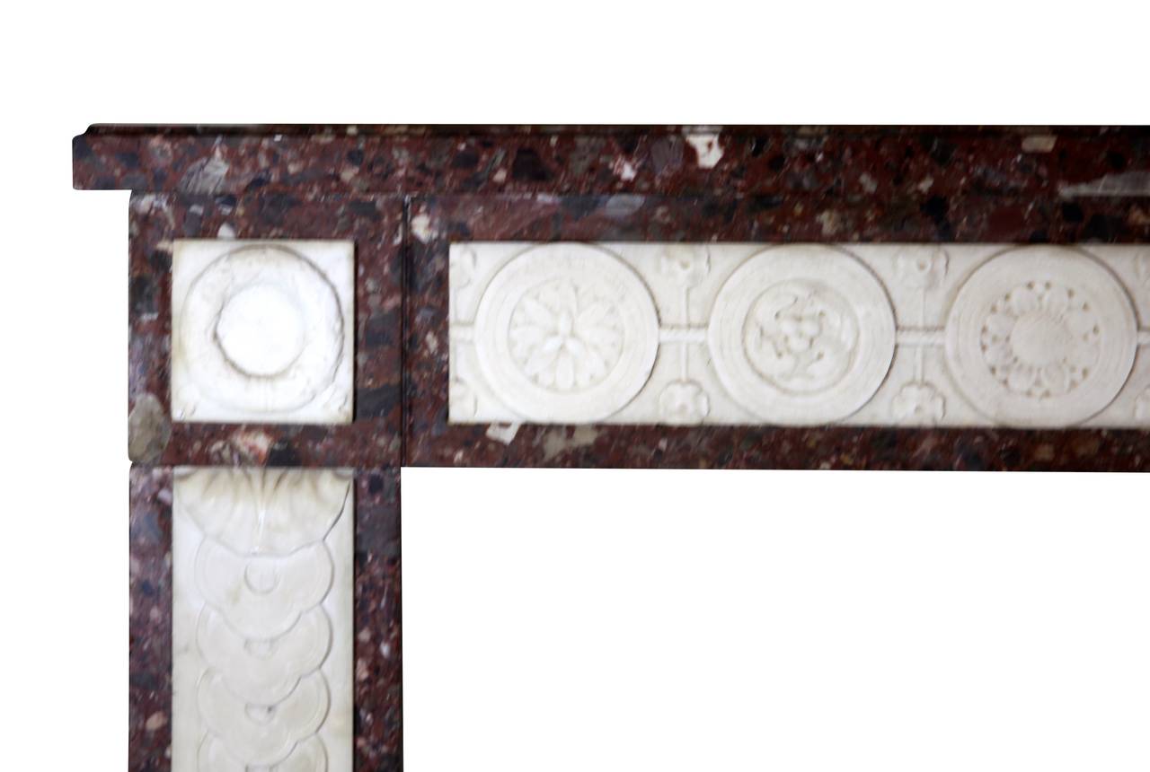 A Brêche marble with white statuary marble inlay is a perfect combination for this vintage chimney piece.
The carving is of an exceptional quality built in the 18th century. Perfect for a luxury home decor with or with lots of color. A one of a