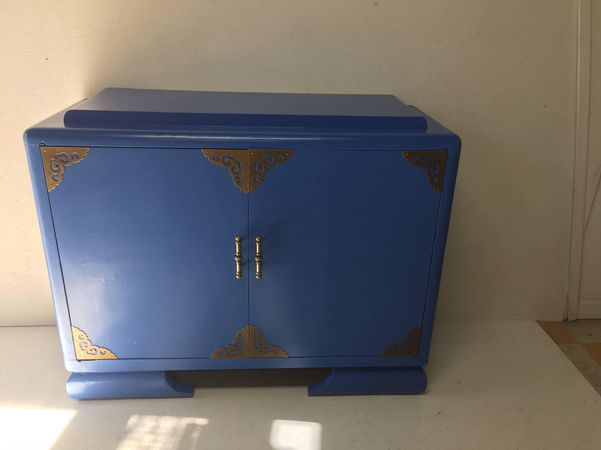 This vintage piece has been given a gloss coat of Athens blue and is now ready to join your collection of blue and white porcelain. Beautiful anywhere in the home, the interior has one shelf, a raised platform, and Ming style feet. Would look lovely