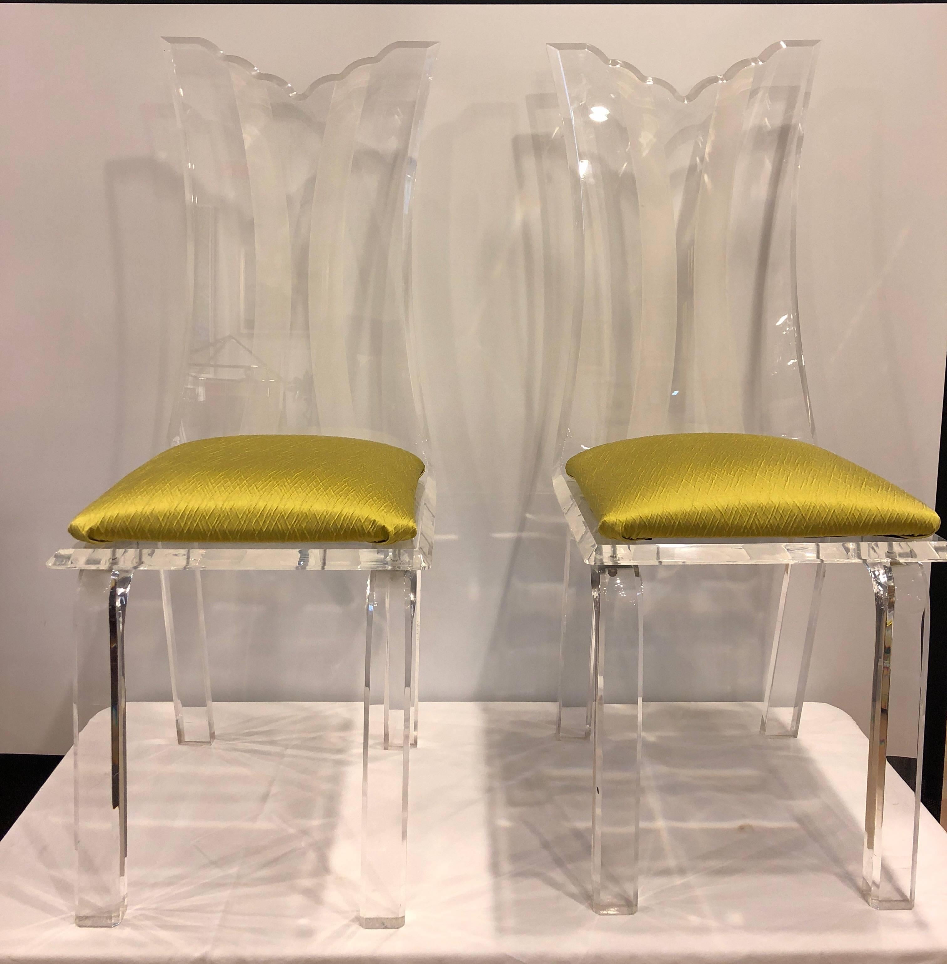 Pair of fabulous vintage, 1960s Lucite chairs covered in a Chartreuse green fabric. Can easily be recovered. Frosted designs in the frames.