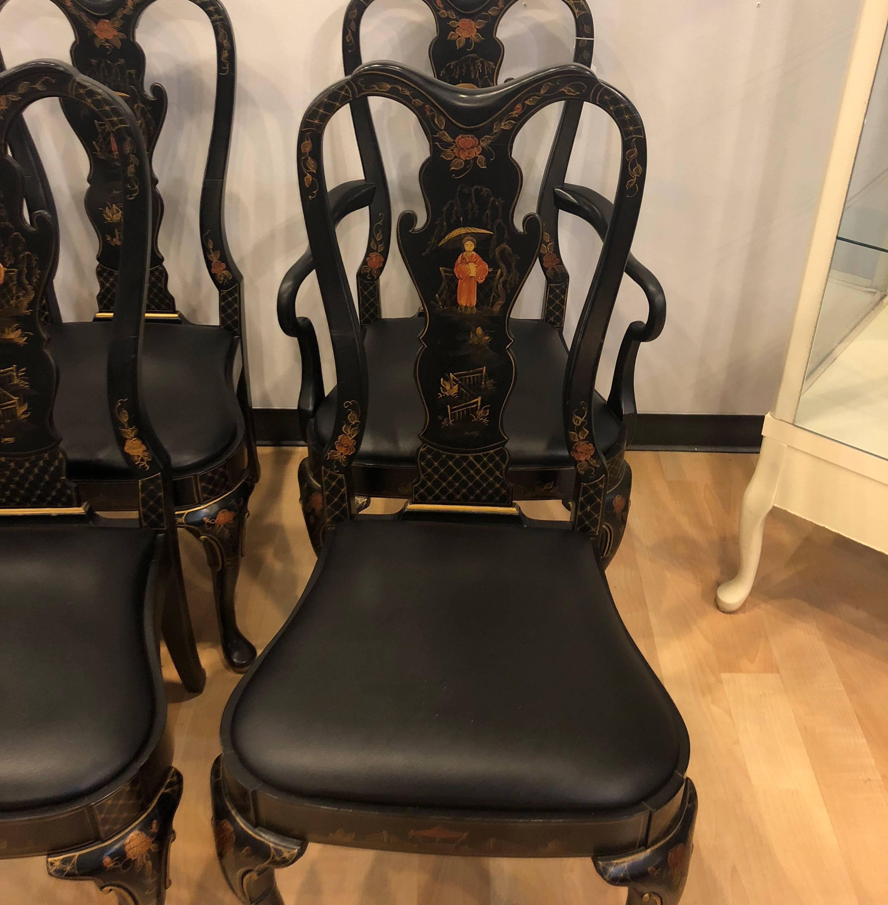 Magnificent set of six black chinoiserie dining room chairs with two arms and four sides with black faux leather seating. Perfect conditions. They are manufactured by Drexel Heritage in the 1980s. Themed painted on front and back of chairs.