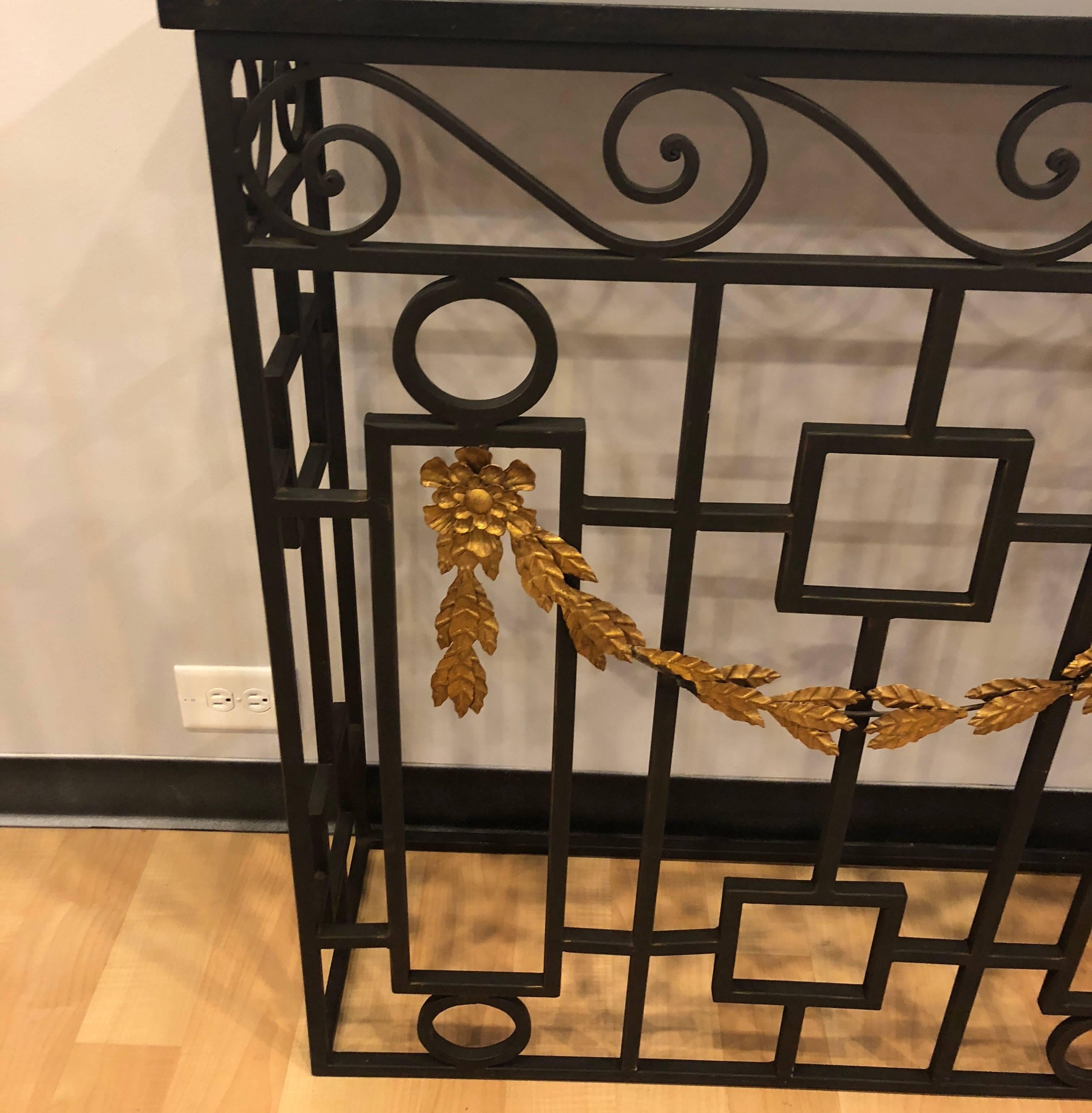 Metal and marble console table with gold scroll work. Excellent condition with no losses to metal or damage to marble. Would be perfect as console or could be used as a radiator cover.