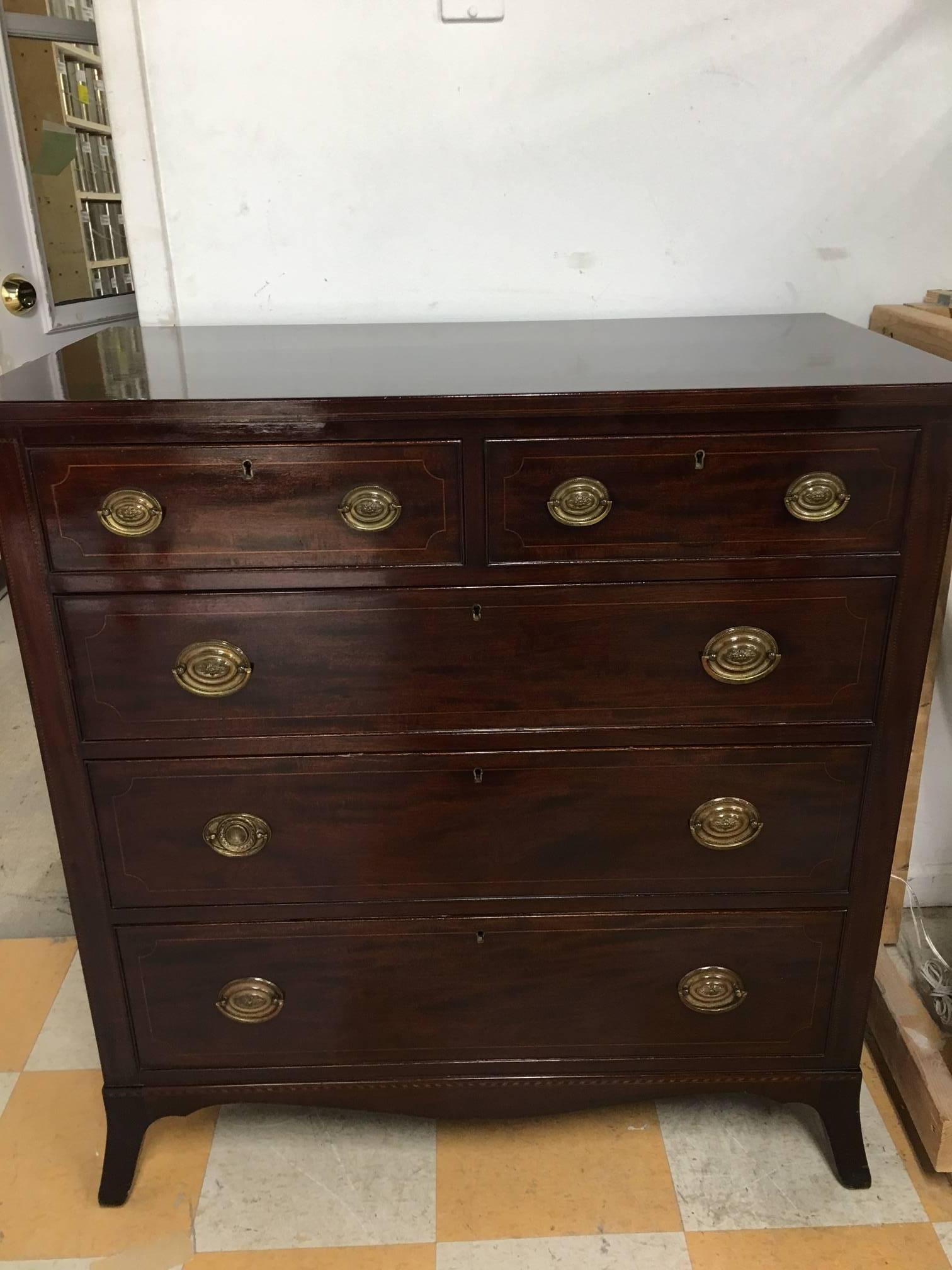 English 19th century Regency style chest of drawers. Two over three drawers. Mahogany. Clean and ready to go. Note minor flaw as pictured. This piece has a deep rich polish and is lovely, in excellent condition for its age. 