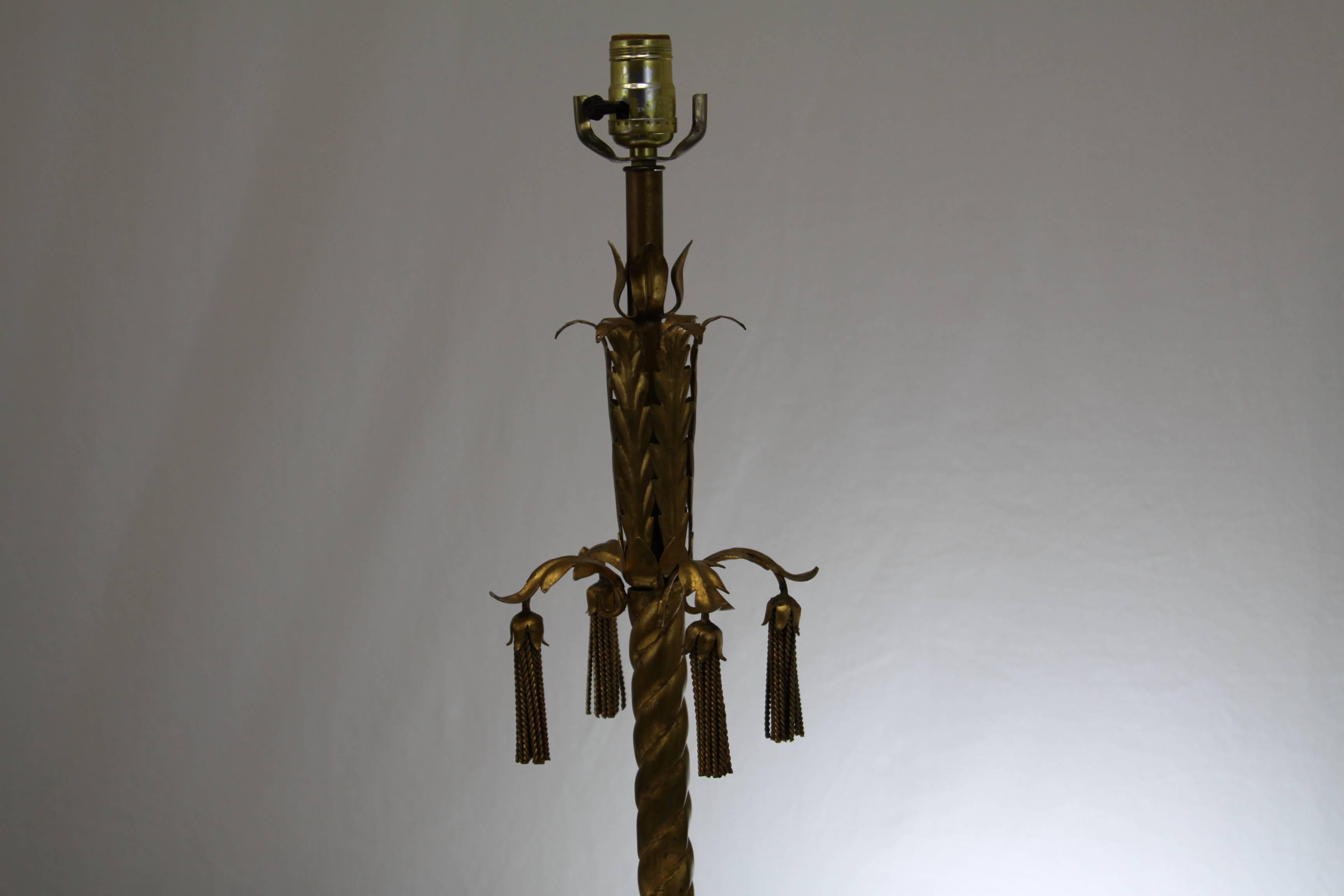 Hollywood Regency style gilt Italian tassel lamp with marble base, metal tassels, acanthus leaves. All gilt. Excellent condition.