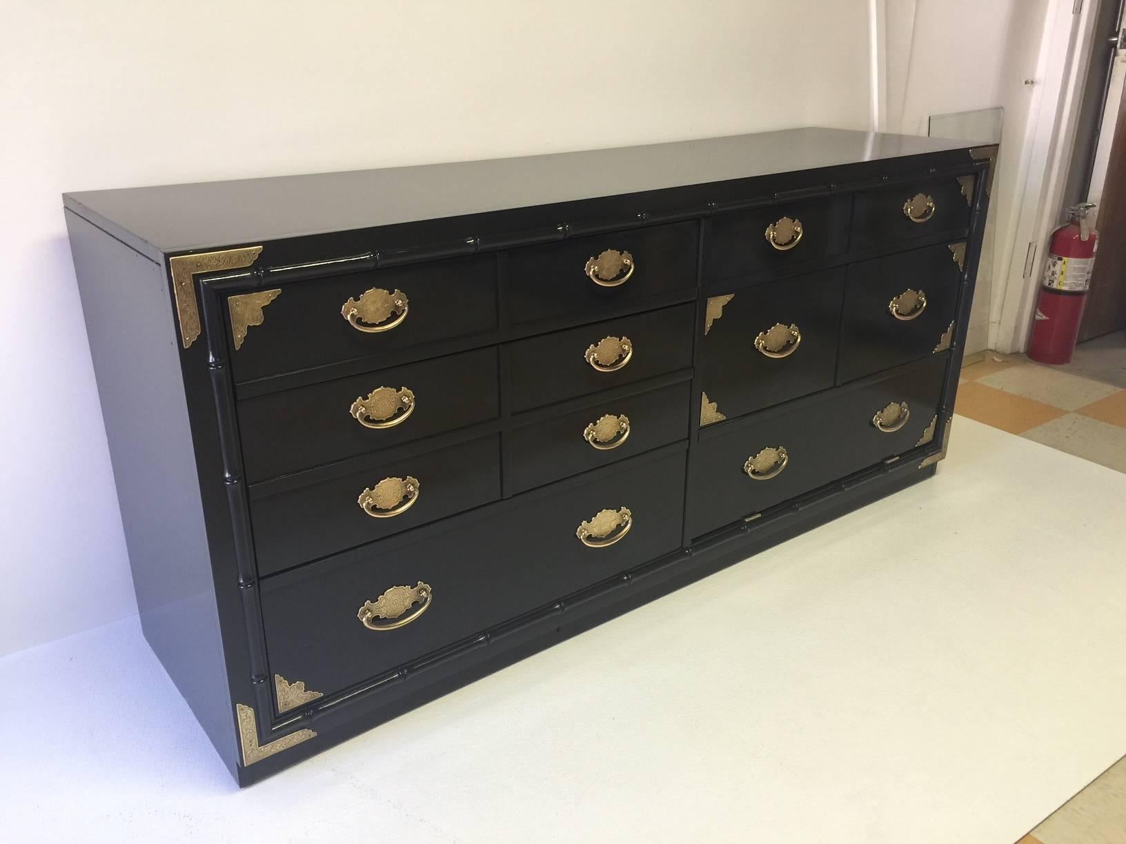 This lacquered credenza has six large drawers and provides great storage.  The unique Asian-themed hardware has been polished and sealed. This gorgeous cabinet has two matching mirrors and a matching bedside or side table cabinet in other listings.