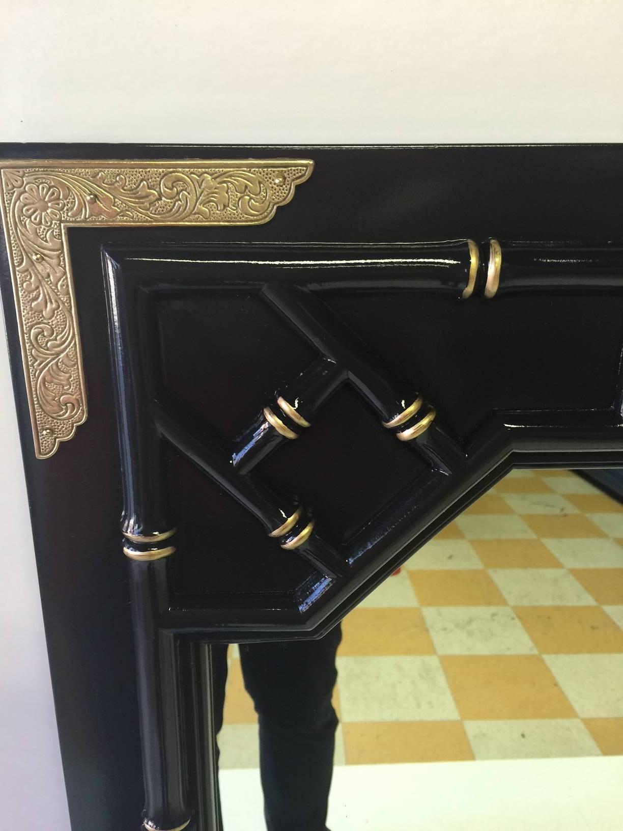These fabulous mirrors have been lacquered in Contessa's Cape in a high gloss finish. 18-karat gold detailing has been added to bring out the faux bamboo detailing and fretwork. These mirrors have companion listings of a credenza or dresser and a