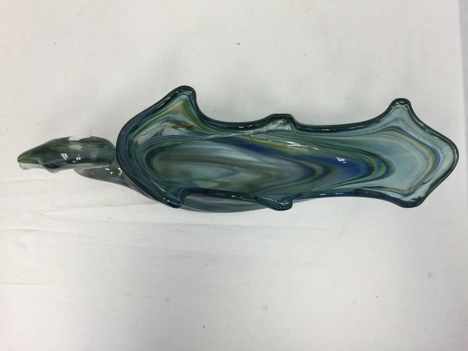 This rare Murano bowl is large enough to serve as a centerpiece bowl or a serving dish, but is delightful as a decorative sculpture. It features shades of teal, smoke and olive. Perfect condition.