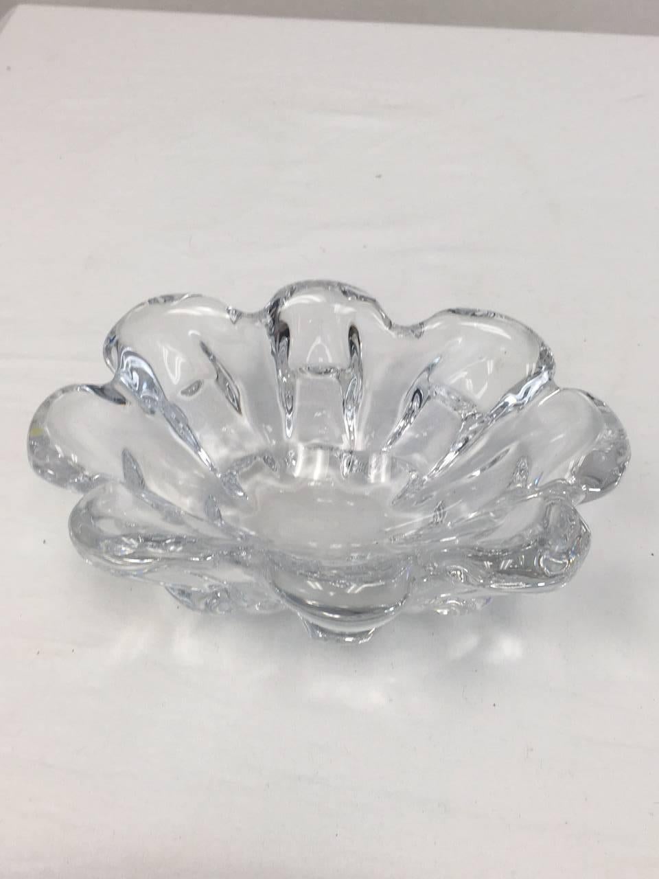 This Orrefors art bowl is flower shaped, heavy and in perfect condition. It is signed and numbered on the bottom, and is probably by designer Lars Hellsten.