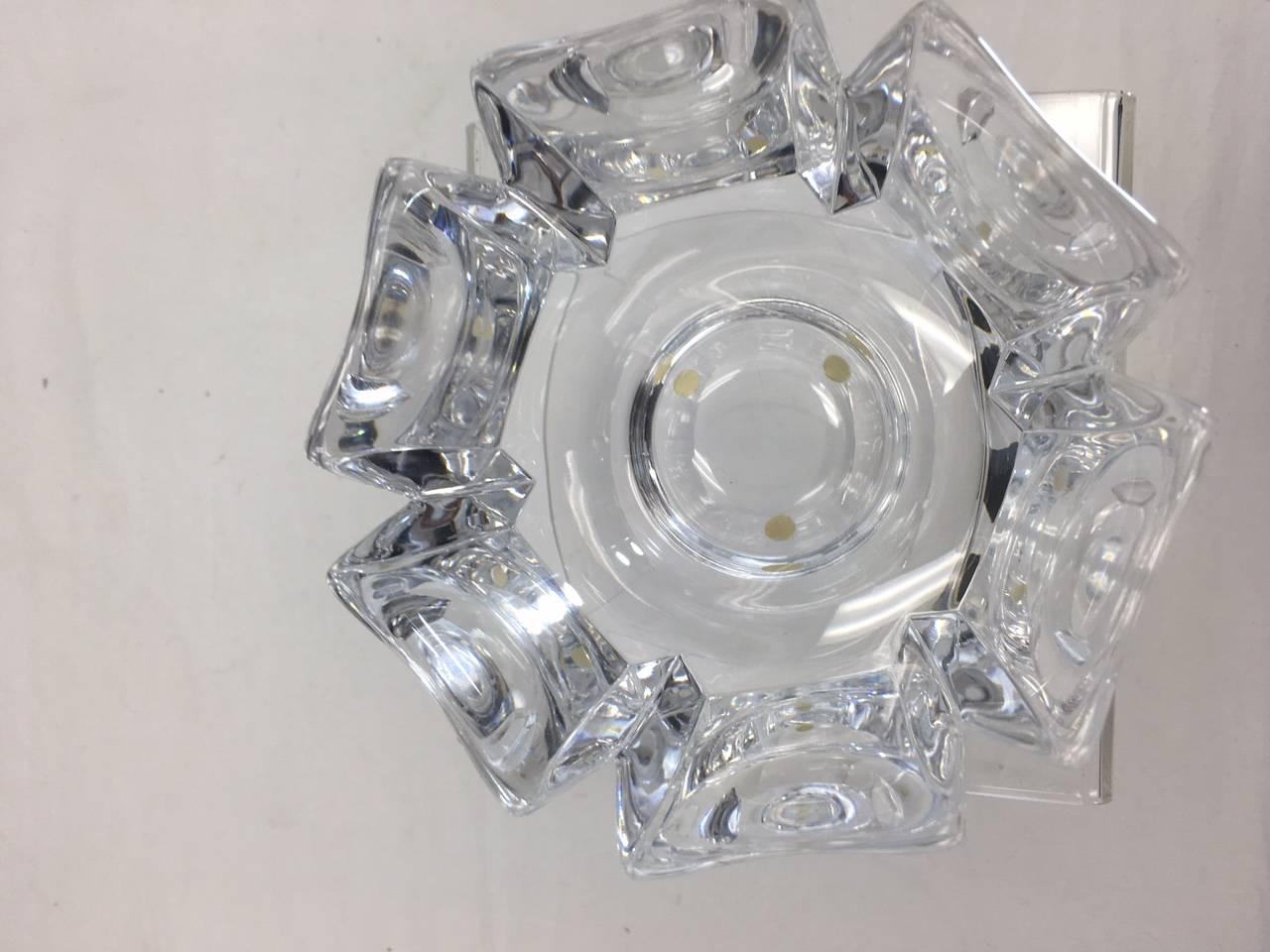 This bowl is made of crystal (its very heavy) and is a lovely Classic yet organic shape.