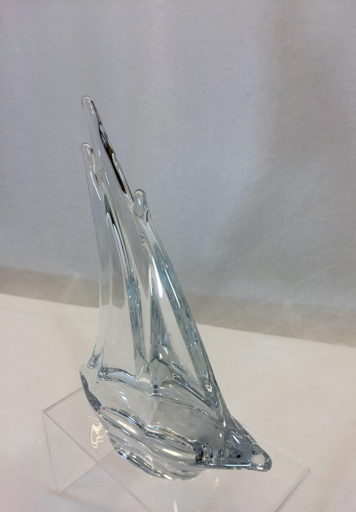 In perfect condition, this crystal sculpture is signed Daum, France as shown in photo. It is very heavy with no signs of wear.