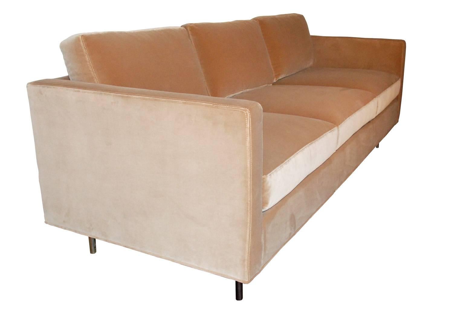 This Milo Baughman sofa by Thayer Coggin is all luxury and comfort. Upholstered in a camel/caramel velvet, it is in near mint condition. Seats three across and stands on chrome legs. 

Height provided is arm/back height; cushions extend beyond