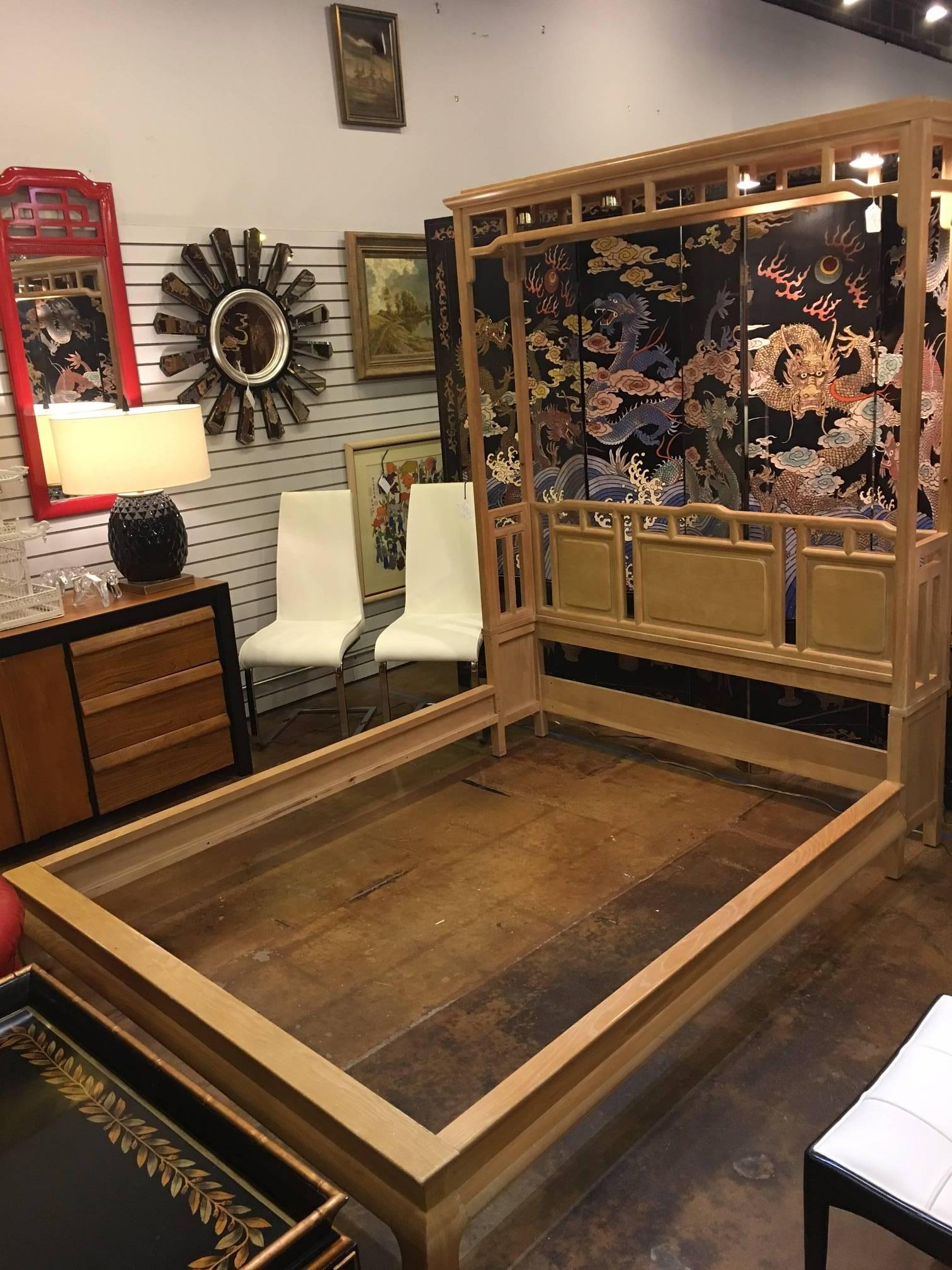 This bed frame is unmarked but we are fairly certain it was made by Century. It is an Asian style with ming feet, chinoiserie detailing and a reading canopy with lighting. I has minor scuffs and signs of wear, but is very sturdy and all parts are