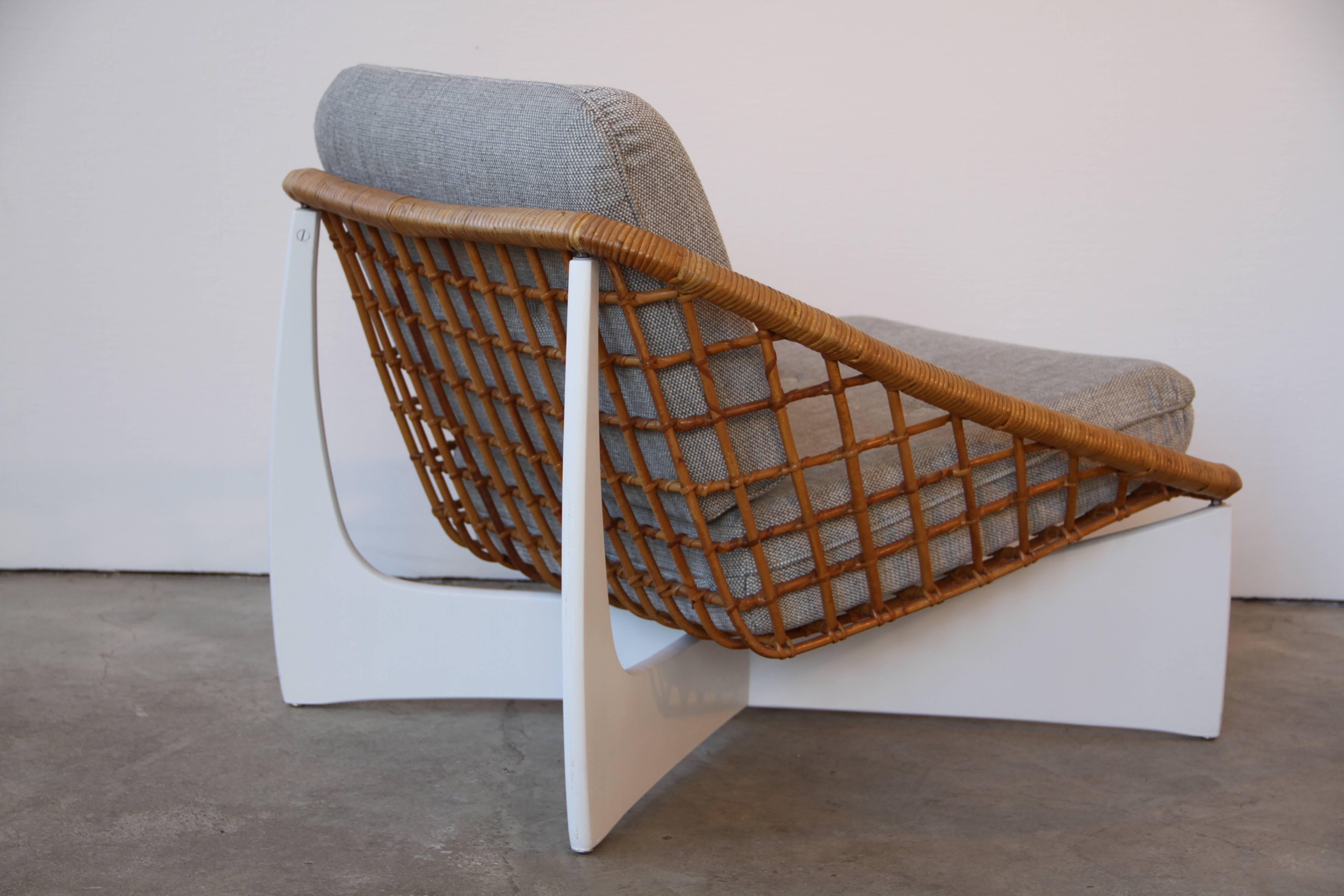 Rare armchair composed by a bamboo basket on a white wood foot
new foam and fabric.