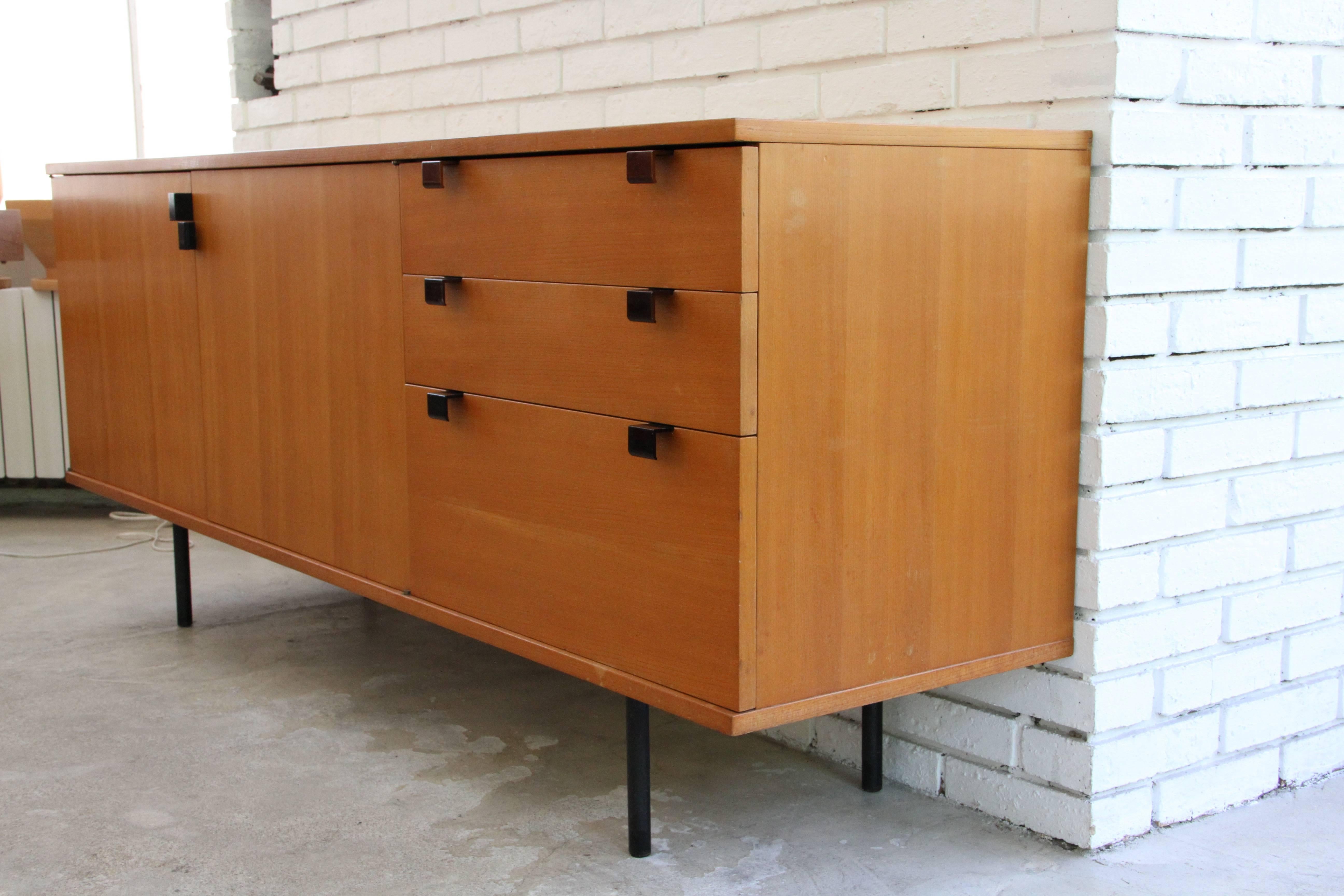 This credenza was designed by Alain Richard in 1954,
made by Meubles TV in ash tree, feet and handles are in métal
nice patina, original conditions with some signs of age.