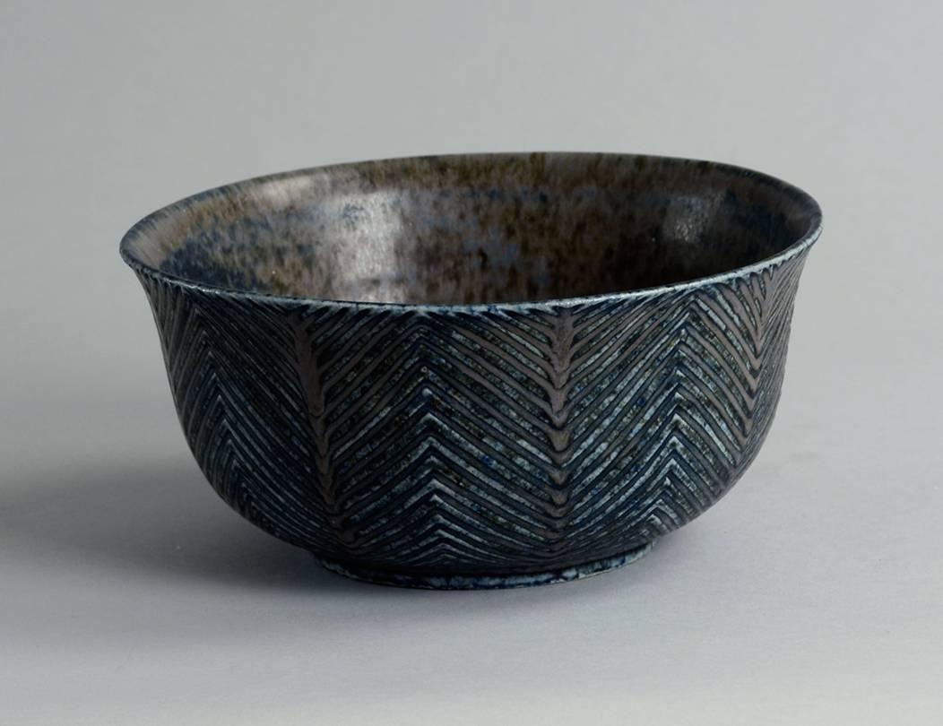 Early stoneware bowl with carved lines to exterior, matte blue and gray glaze, 1930s.