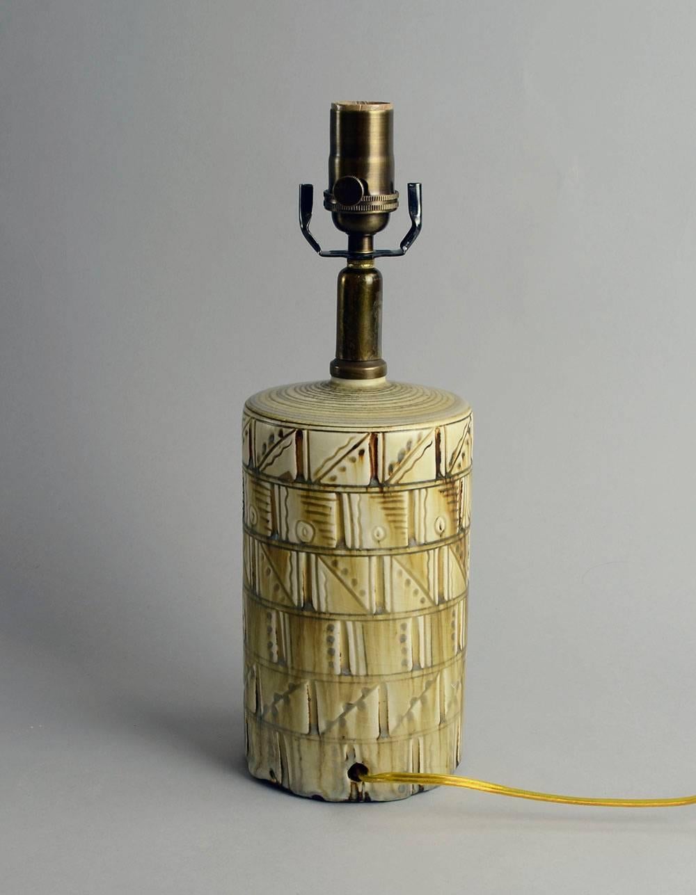 Stoneware lamp with carved pattern to exterior with matte oatmeal glaze, 1924.