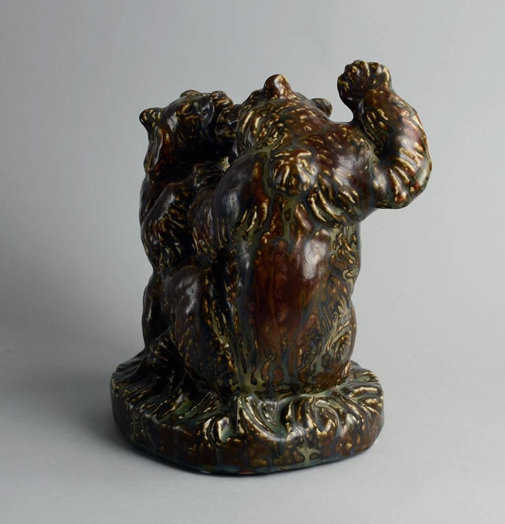 Knud Kyhn for Royal Copenhagen, Denmark, figure of two fighting bears with matte brown and cream sung glaze, 1965.
 