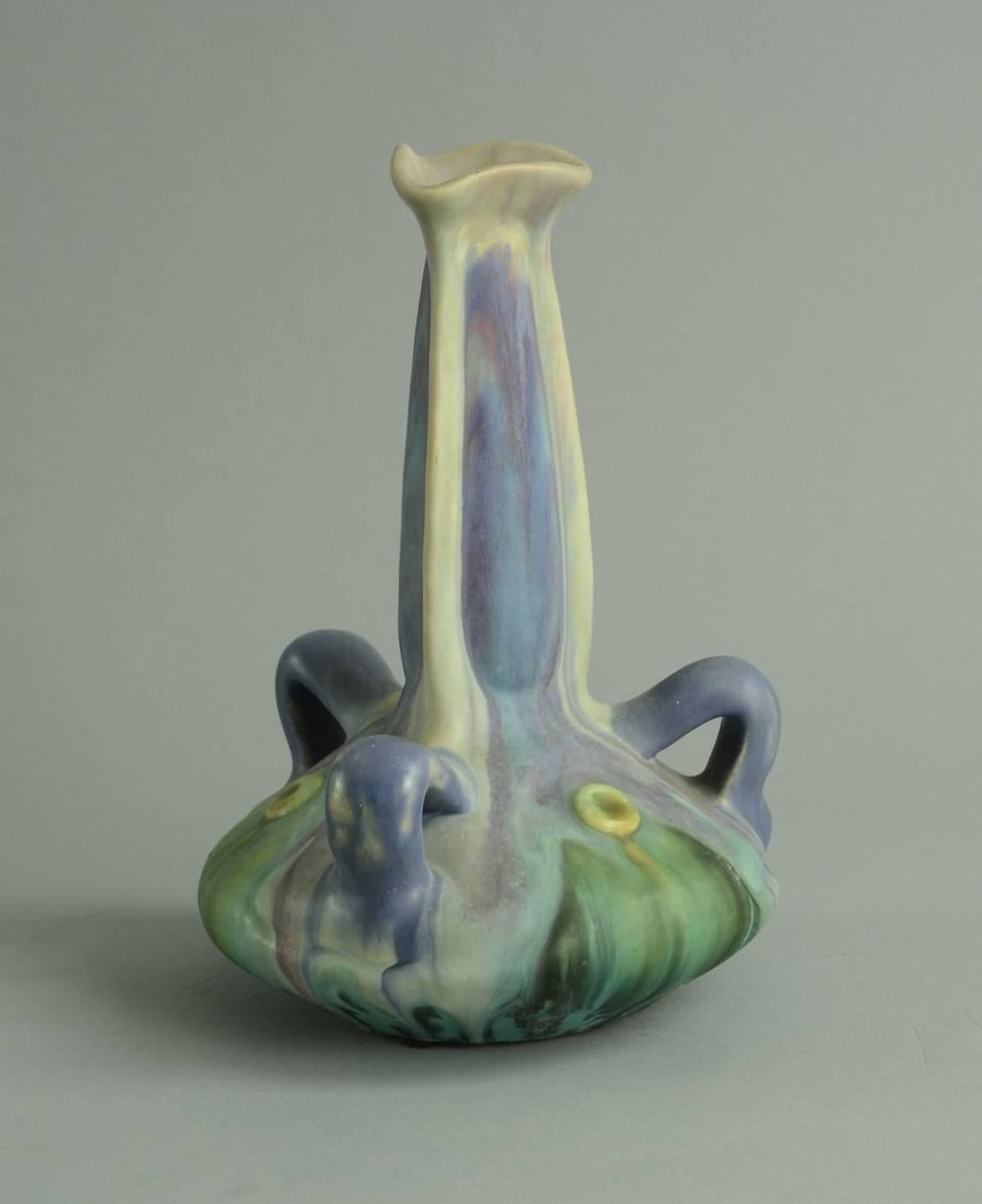 Stoneware vase with acid treated satin matte glaze in blue, purple, green and white, circa 1900.