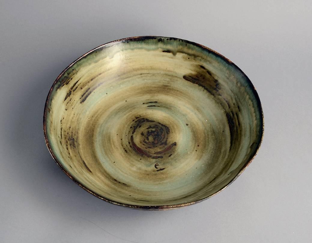 Unique stoneware bowl with carved line pattern to exterior with sung glaze, 1944.