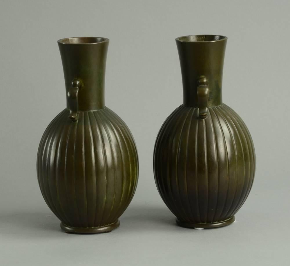 Pair of bronze handled vases.