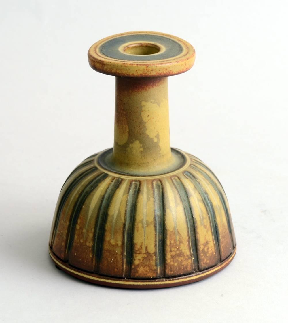 "Farsta" candlestick vase with impressed line decoration and matte glaze in yellow ochre, brown and gray, 1958.