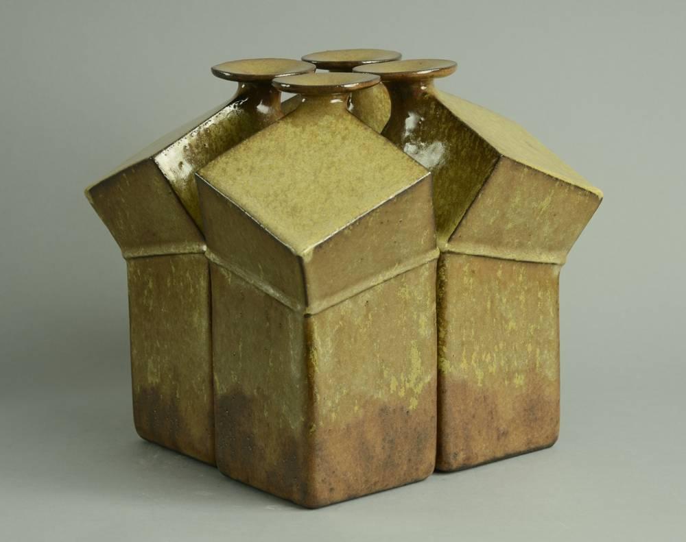 Set of four stoneware geometric bottle vases with glossy golden brown glaze, 1970s.